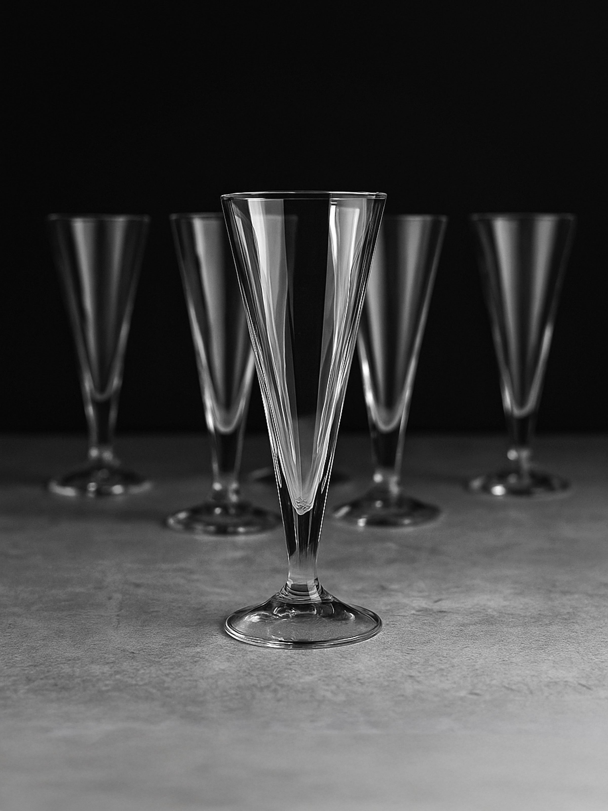 Set of crystal champagne flutes with Art Deco conical design