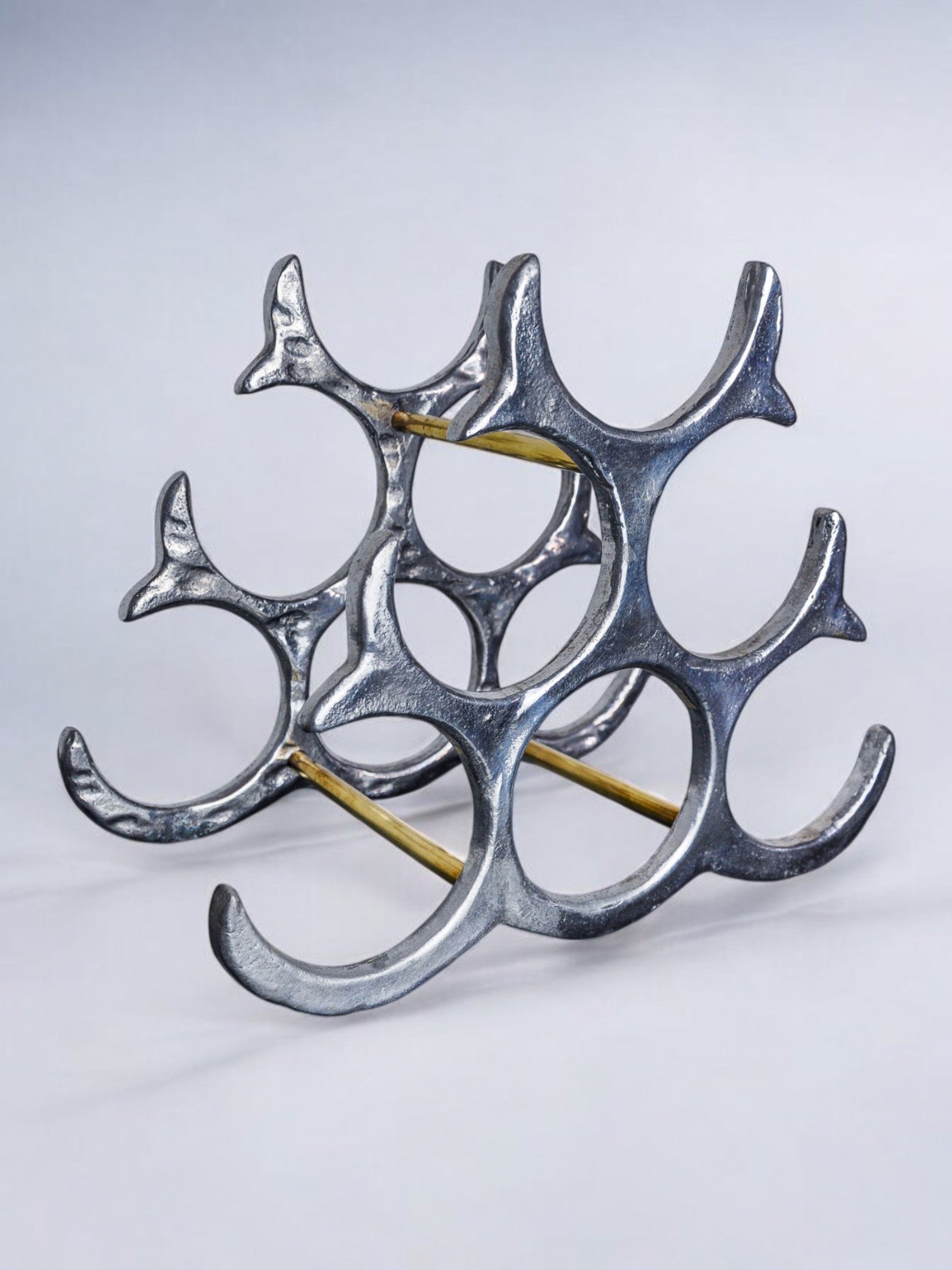 Brutalist bottle rack by Art3, Spain, 1980s — angled view highlighting metallic finish and structure