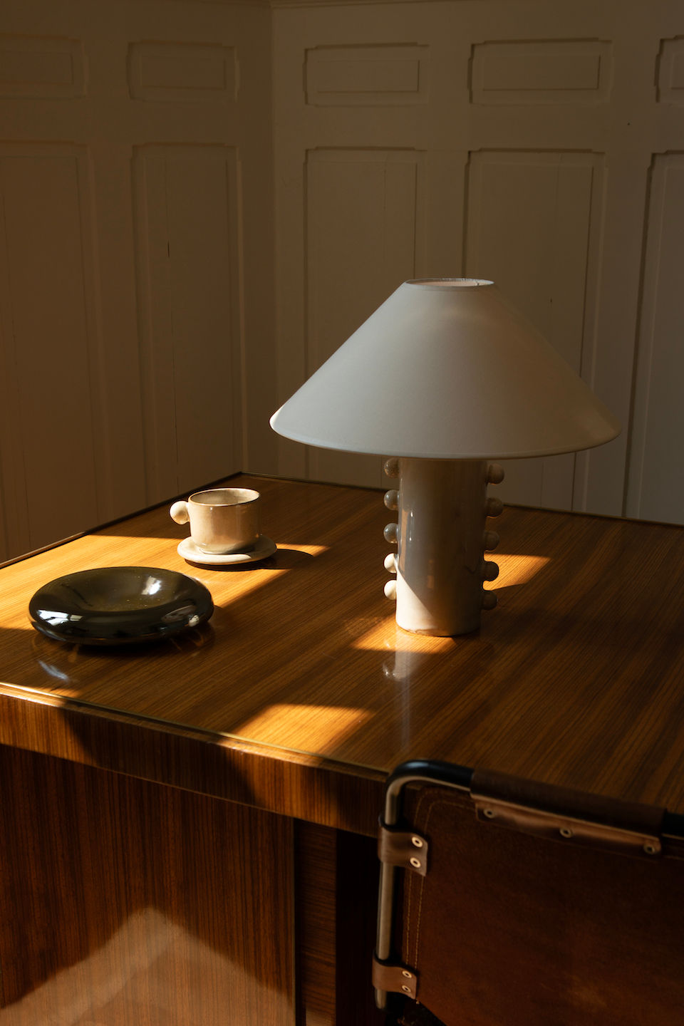 Nicola' Table Lamp — side angle on wooden table with ceramic cup