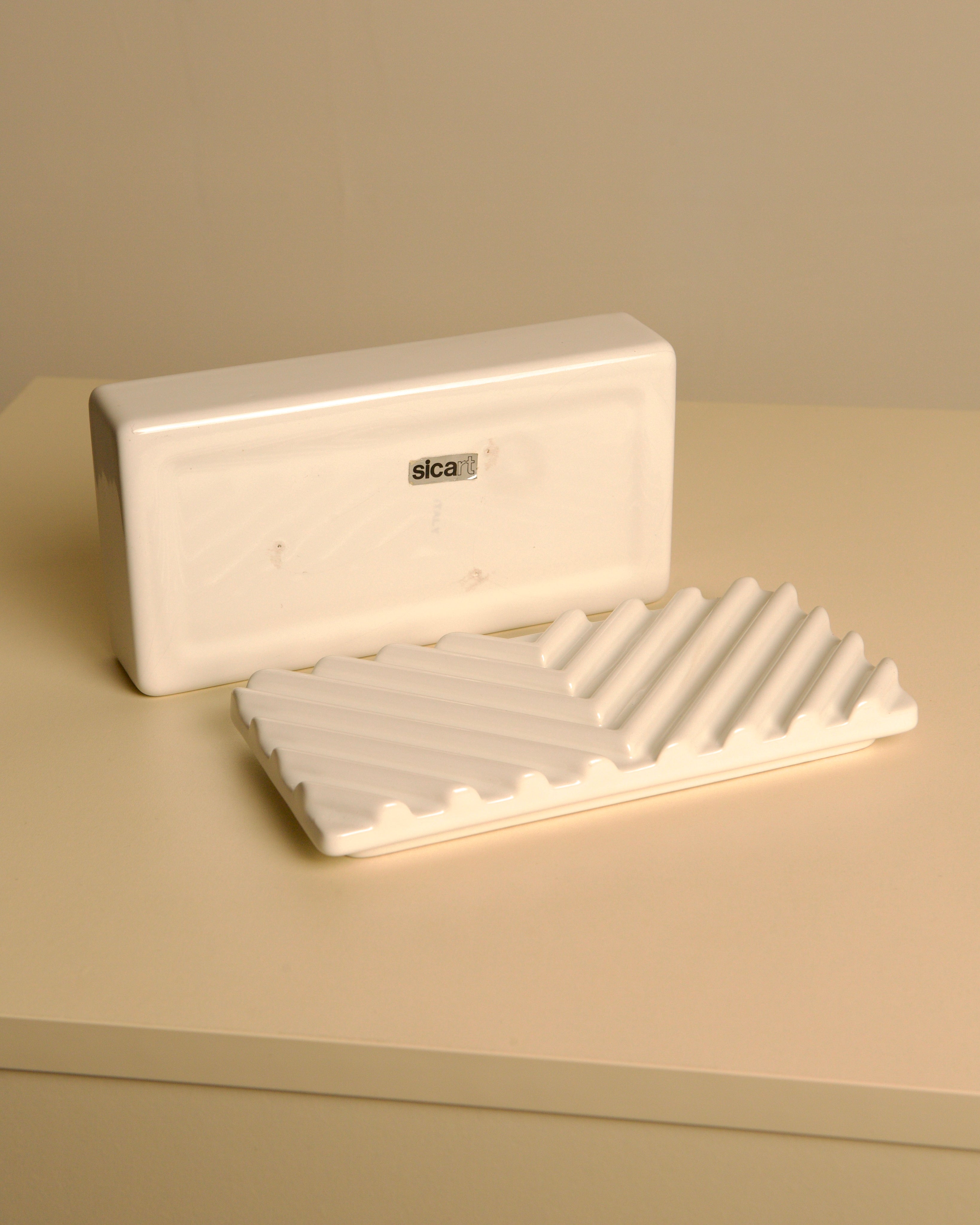 Rectangular Italian box in white ceramic by Sicart, 1970s — angled view on neutral surface