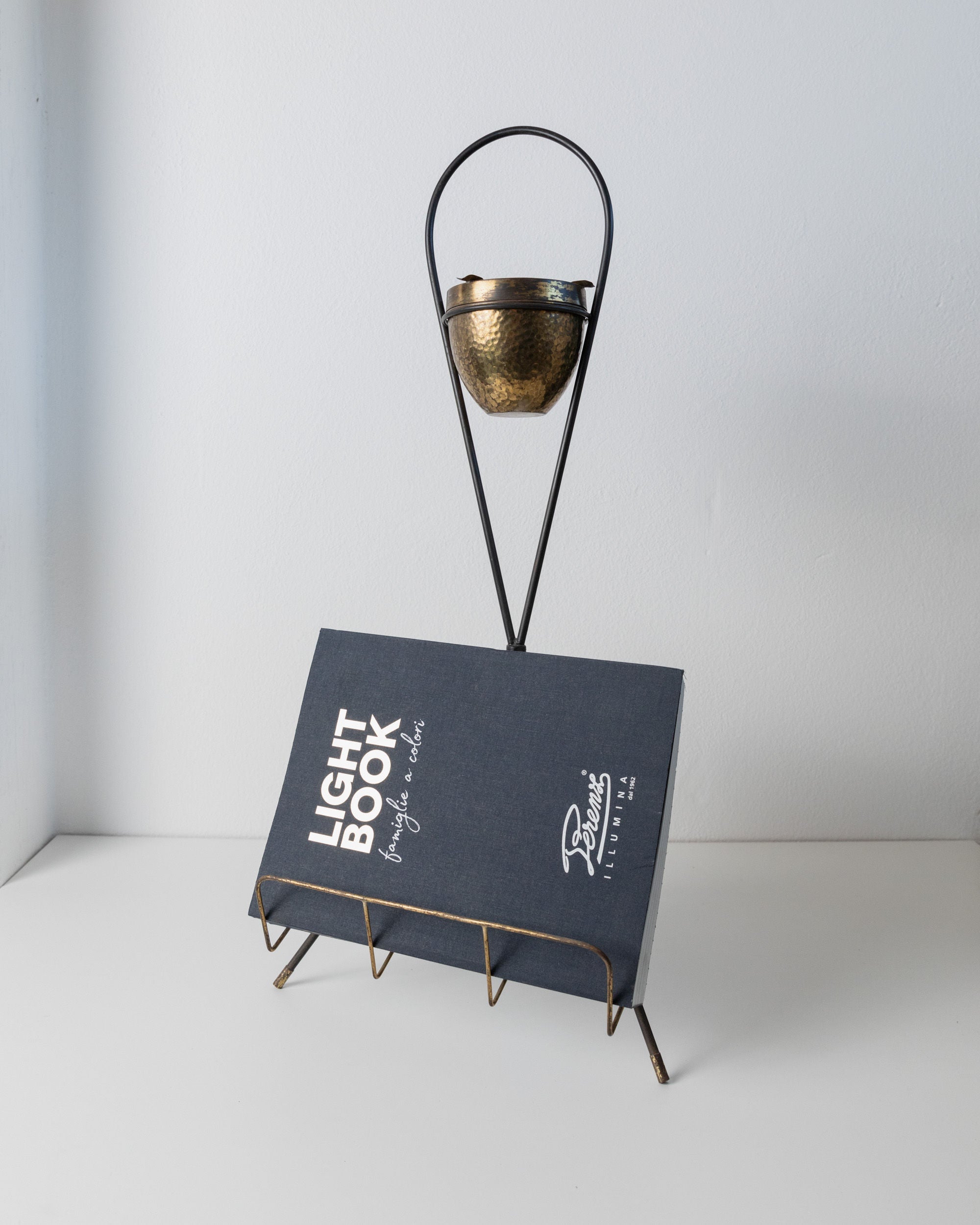 Brass Magazine Rack and Ashtray 1960s — close-up of brass bowl and wire stand
