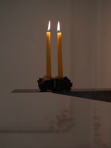 Chrome Candle Holder — top view with yellow candles on metal base