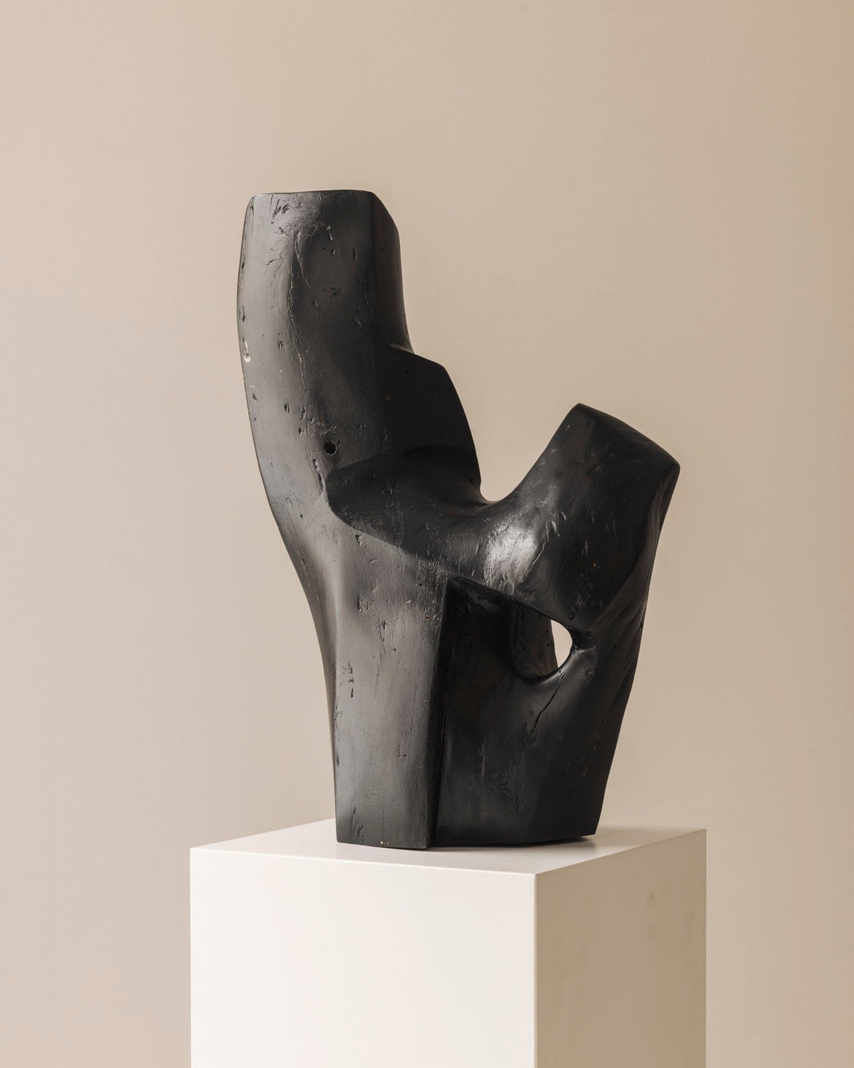 Abstract sculpture in solid dark stained wood dating from the 1950s. — detail view