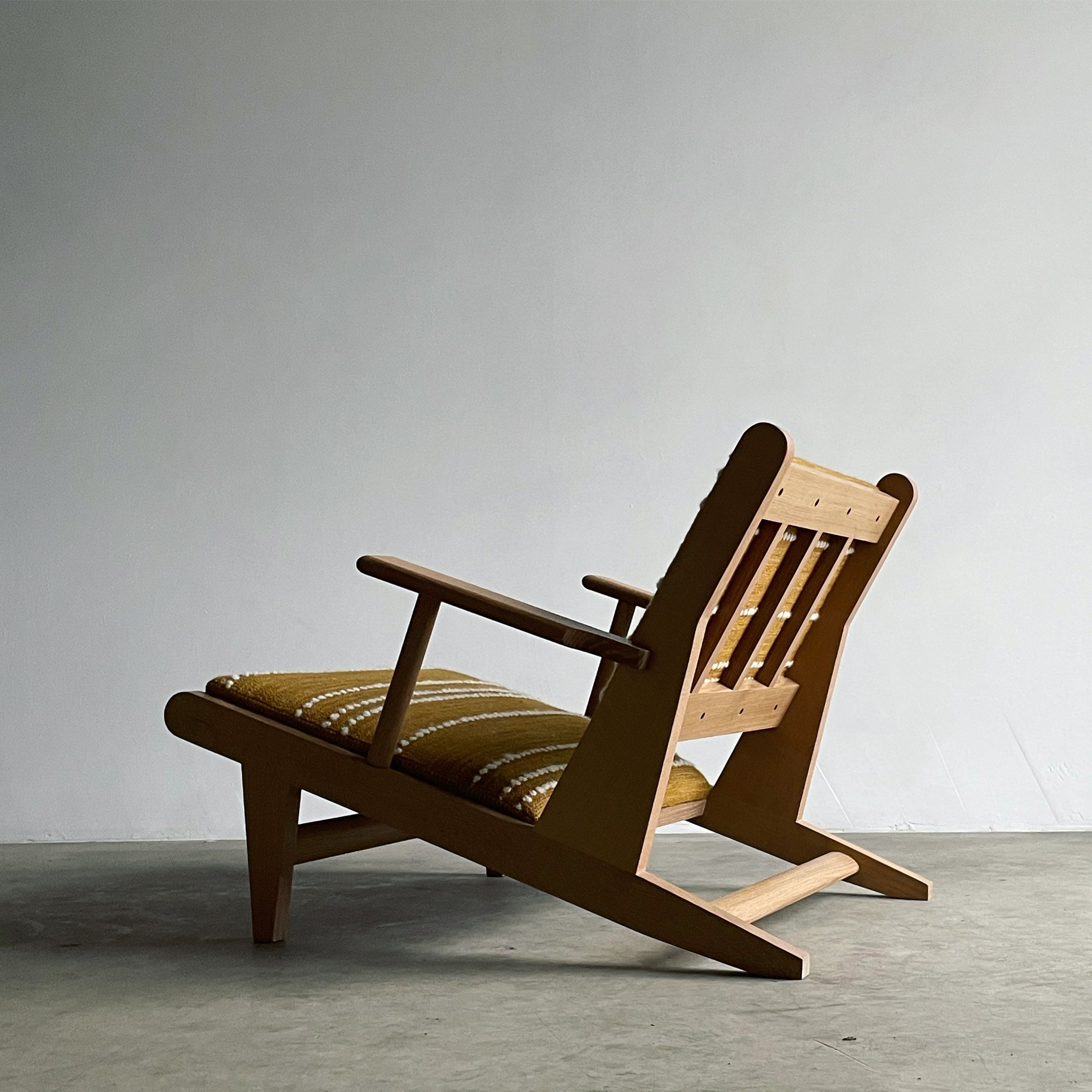 Hunting Chair — angled view with wooden frame and yellow cushion