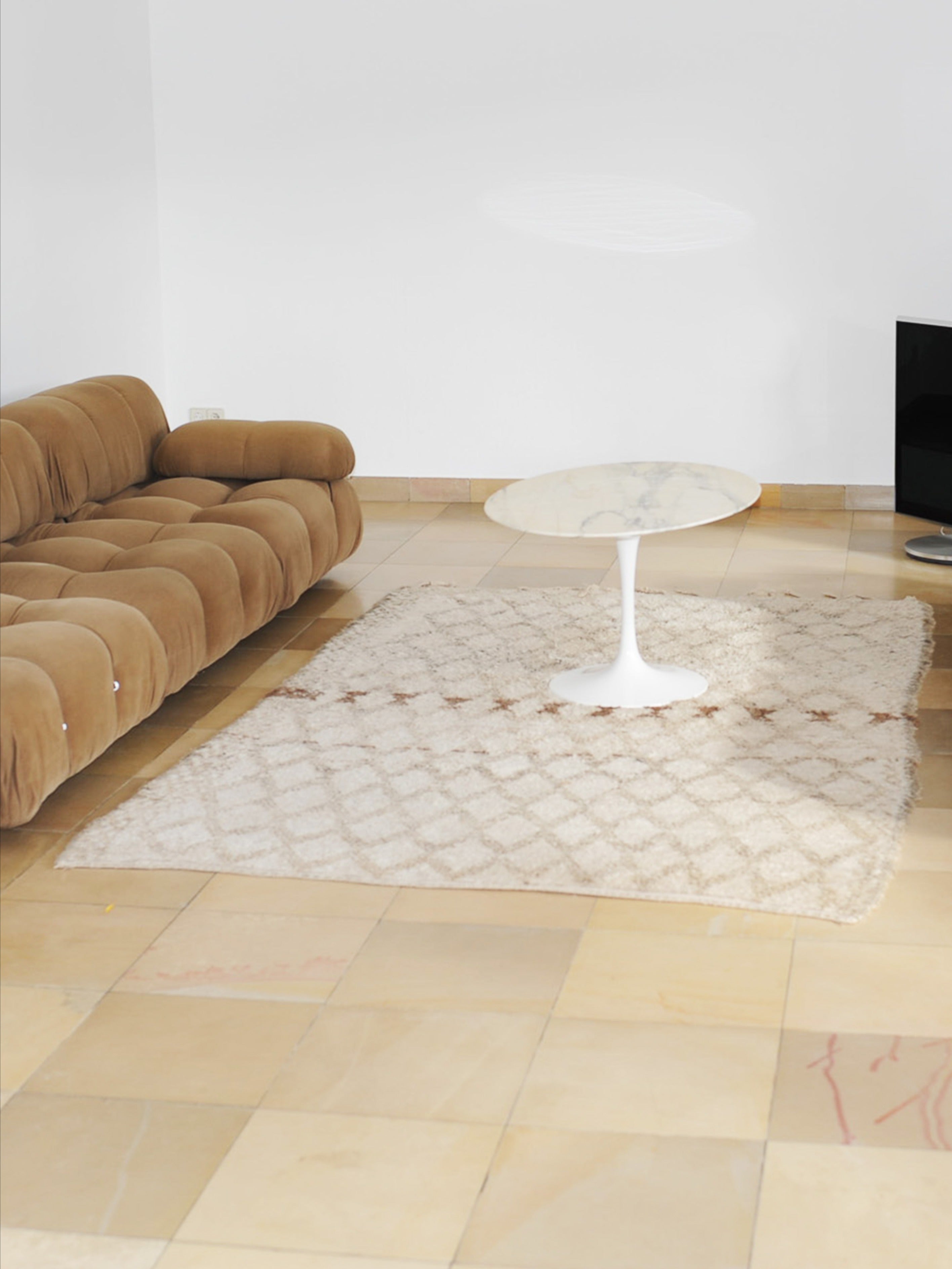 Ivory Moroccan Beni Ouarain Berber Rug 270 x 170cm — placed on tiled floor with sofa and table