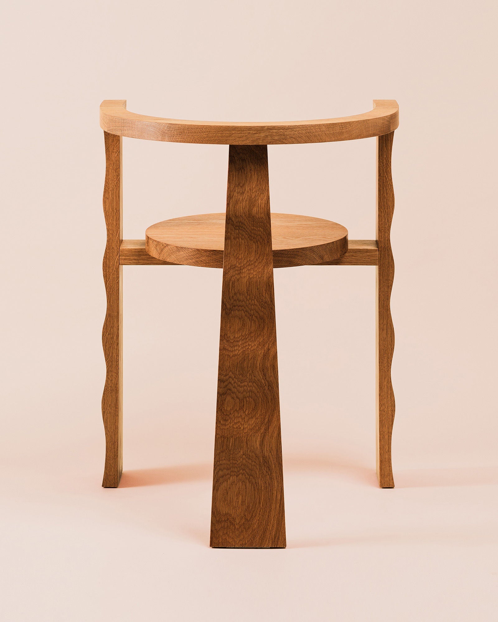 Puro oak chair detail view showing curved legs and circular shelf