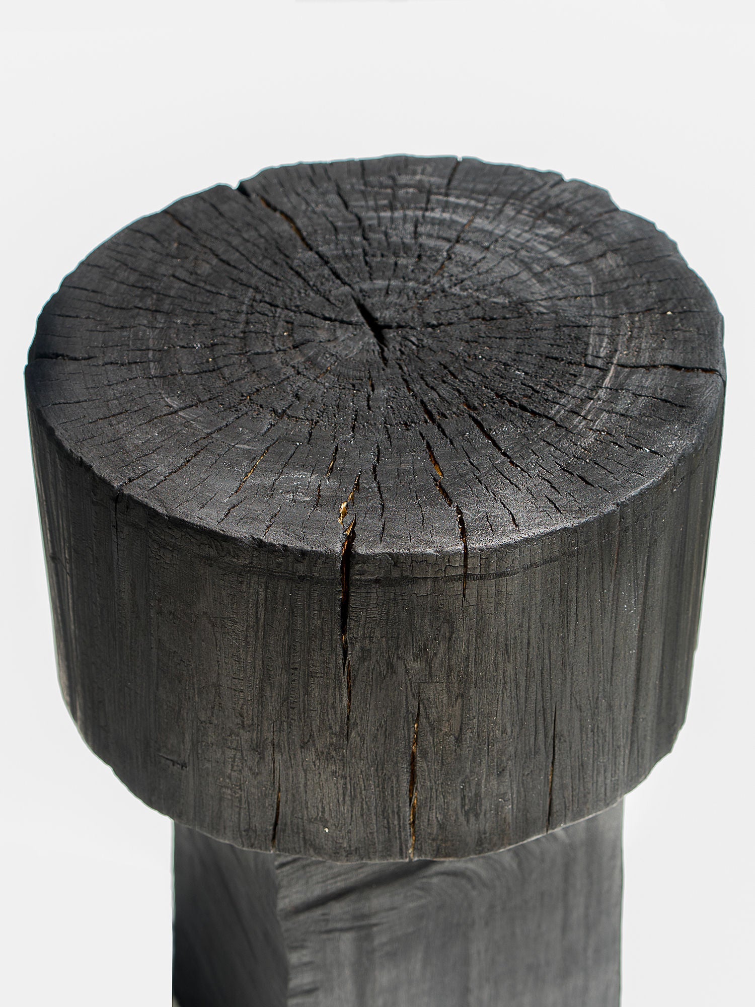 Burnt Black Coffee Tables/Stools — top view of textured black wood surface