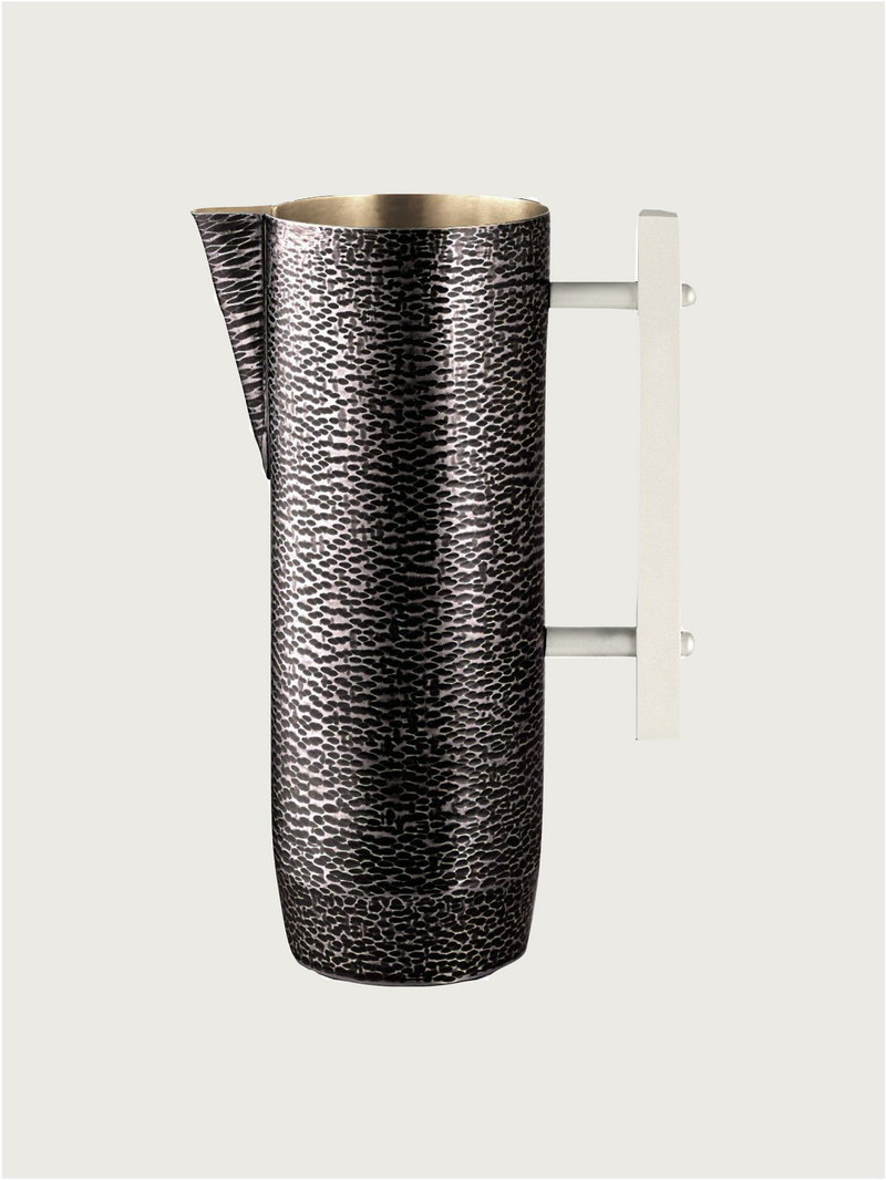 Pitcher in Burnished Metal — close-up of textured surface and handle