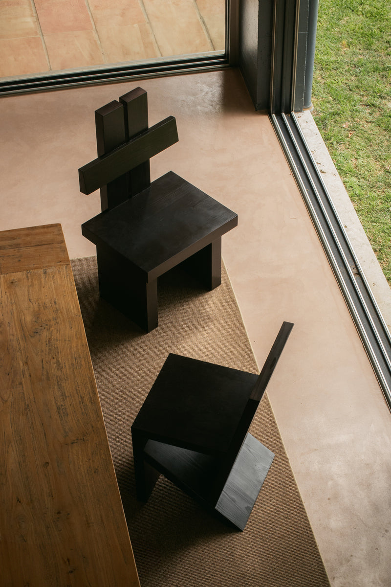 CH02 CHAIR — top view of black wooden chairs in modern interior