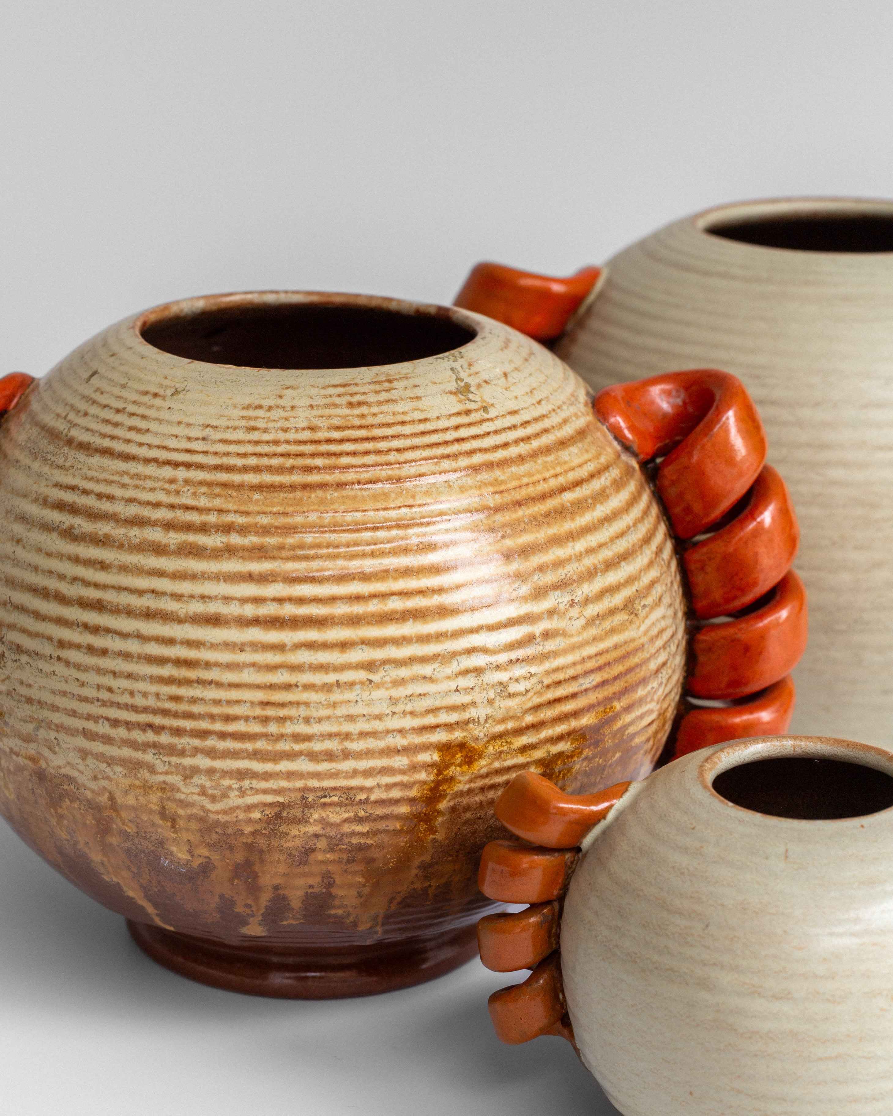 Swedish Modernist Vase with Sculptural Handles — top view showing ceramic texture and orange handles