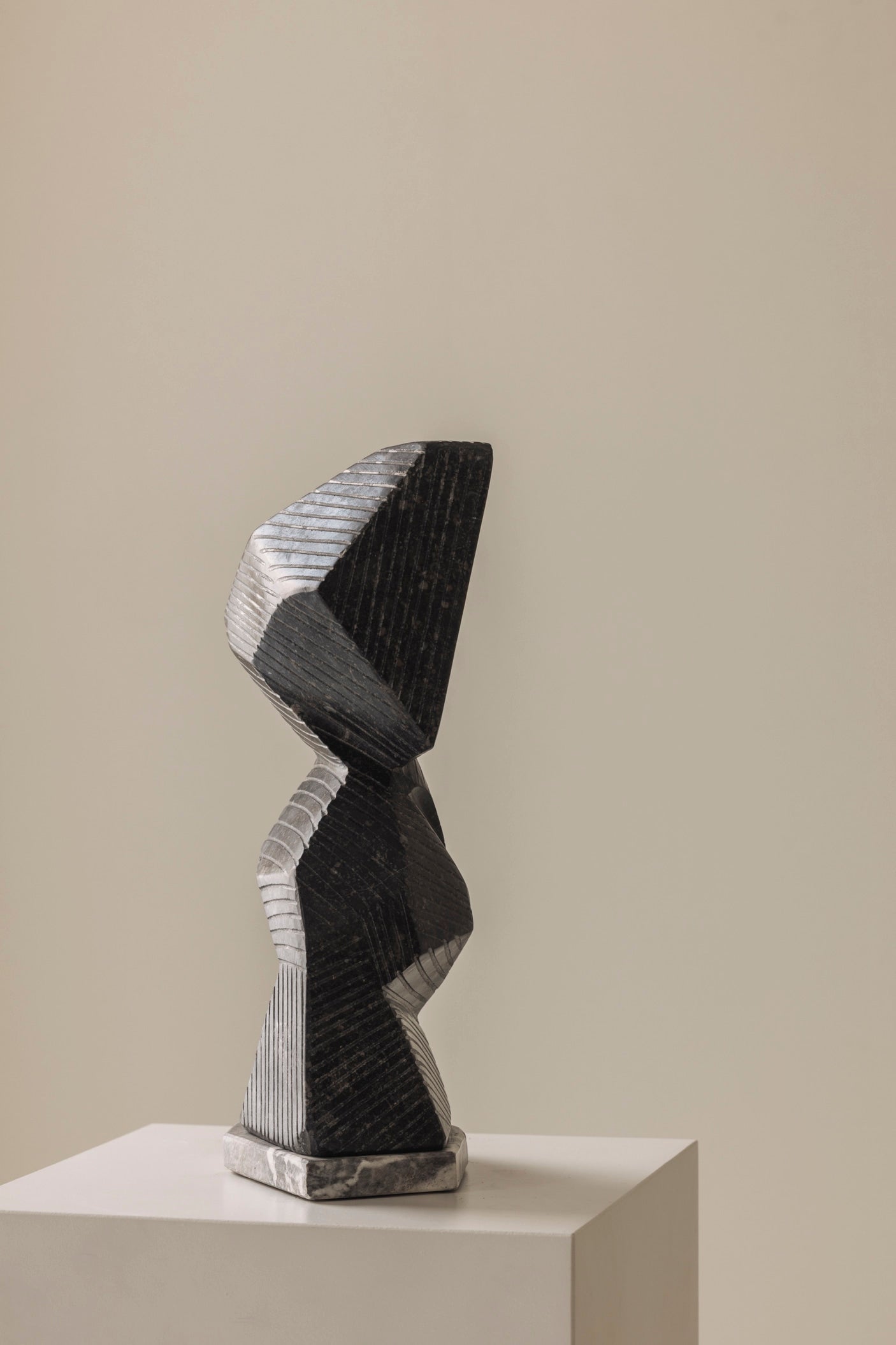 Abstract sculpture Carved from natural stone by Marc Verdoodt, Belgium 1980s. — lifestyle setting