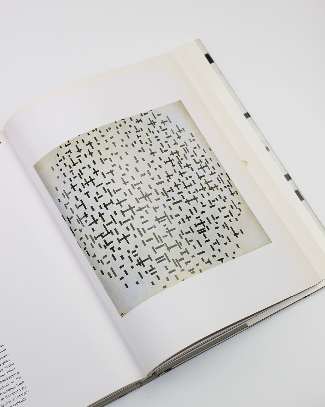 Mondrian — side angle of art book page with black and white patterns