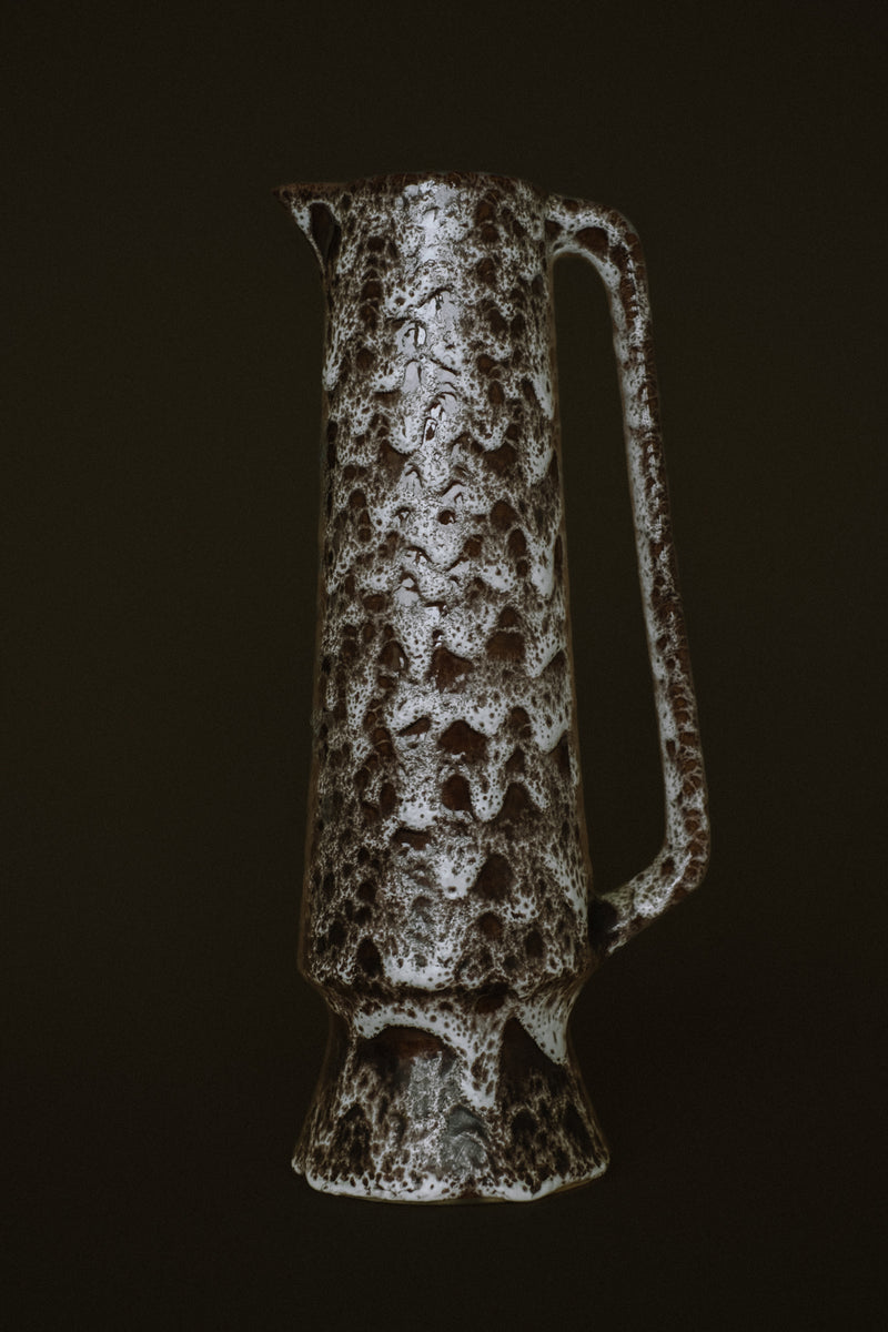 Handmade speckled stoneware pitcher with mottled brown glaze