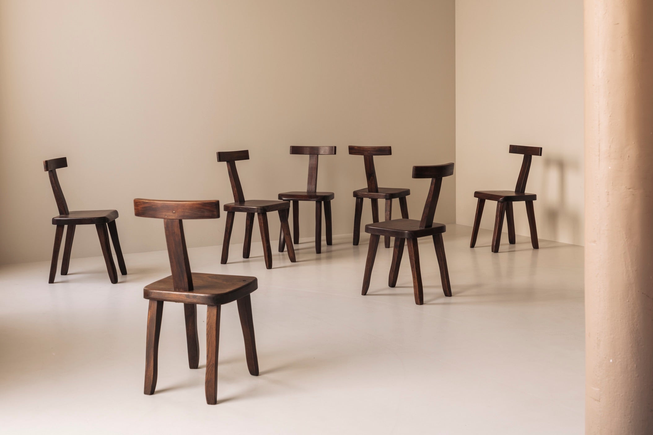 Large set of 8  Brutalist wooden T chairs by Aranjou, France 1960s. by Modern Living | The Oblist