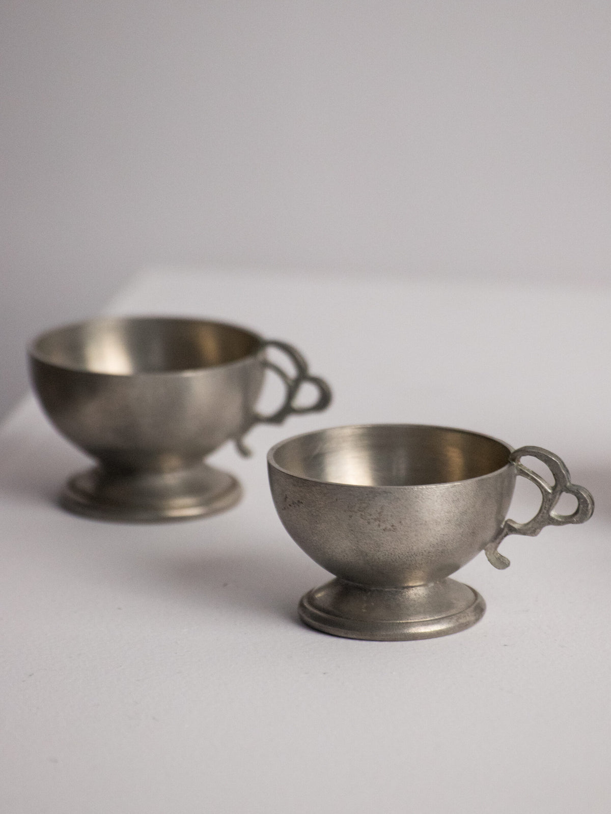 Six Footed Pewter Punch Cups, Triple-Loop Handles, Sweden 1977 — close-up