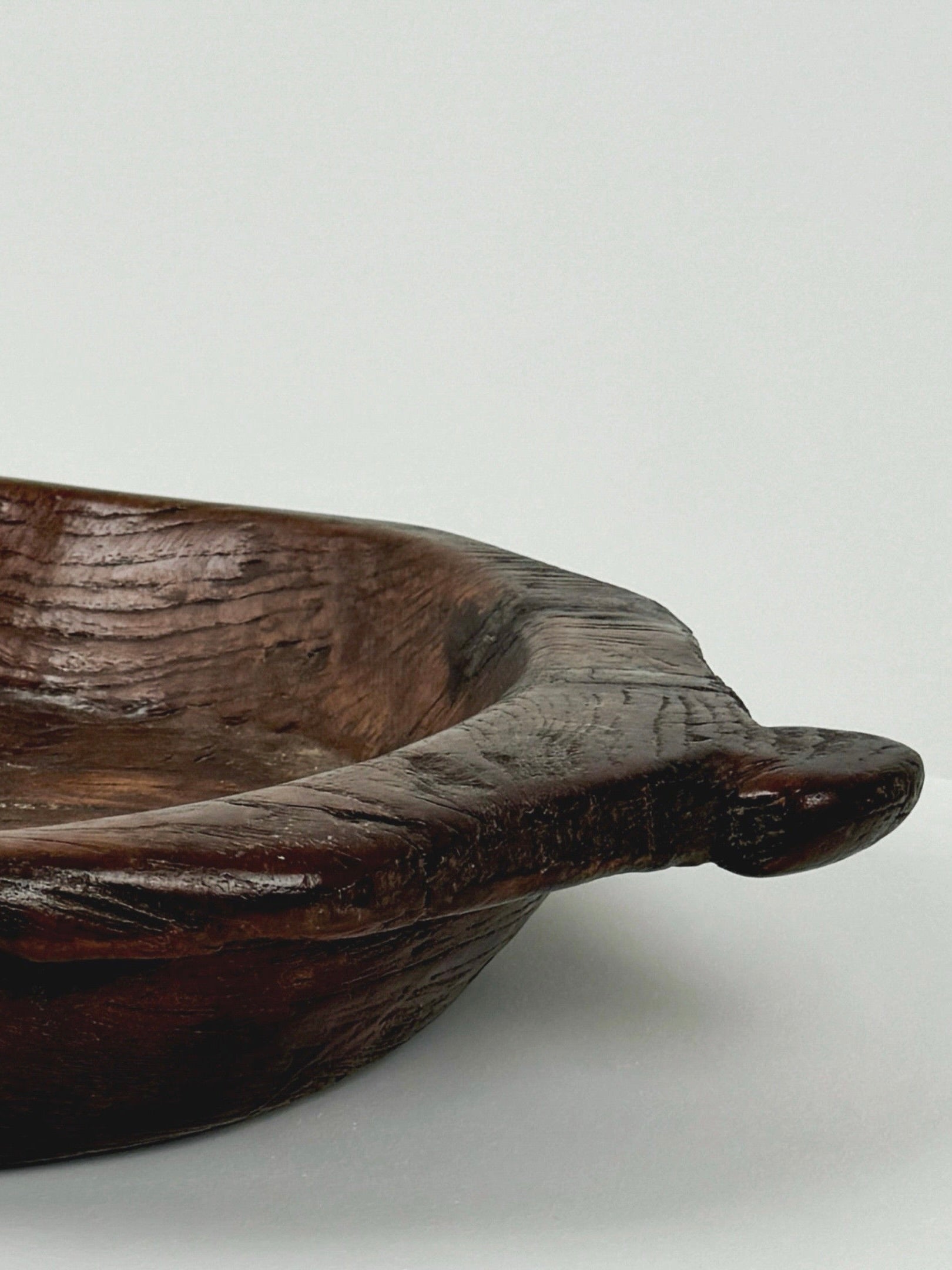 Large Monoxyle Bowl 19th Century — side angle showing dark wood grain