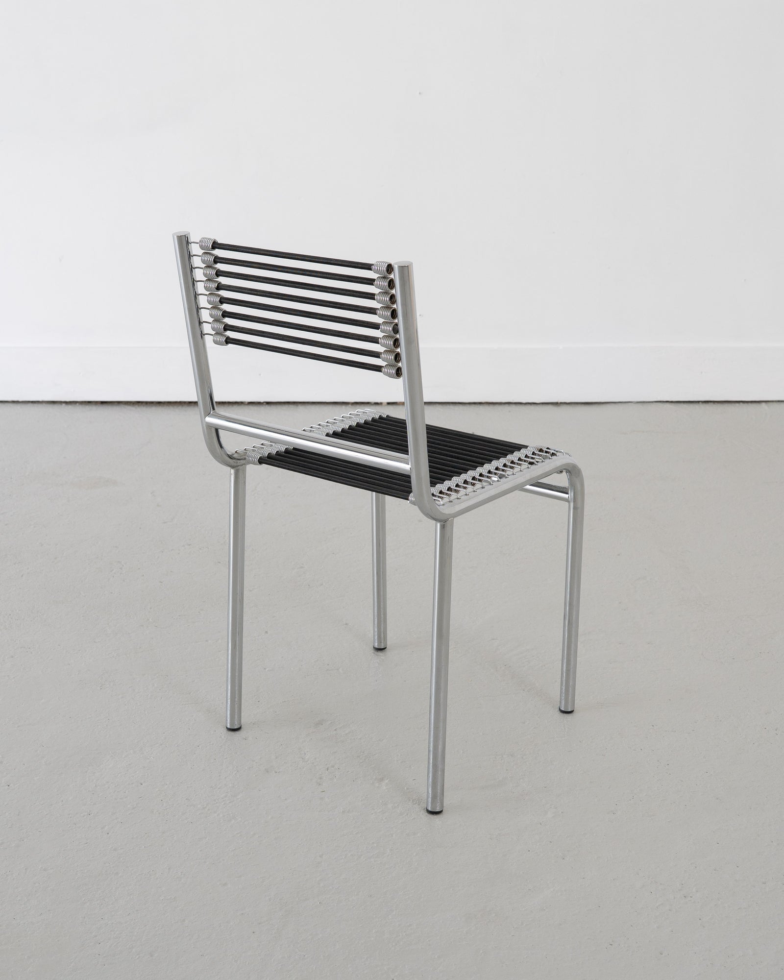 Four Sandows Chairs by René Herbst, c.1980 — side angle