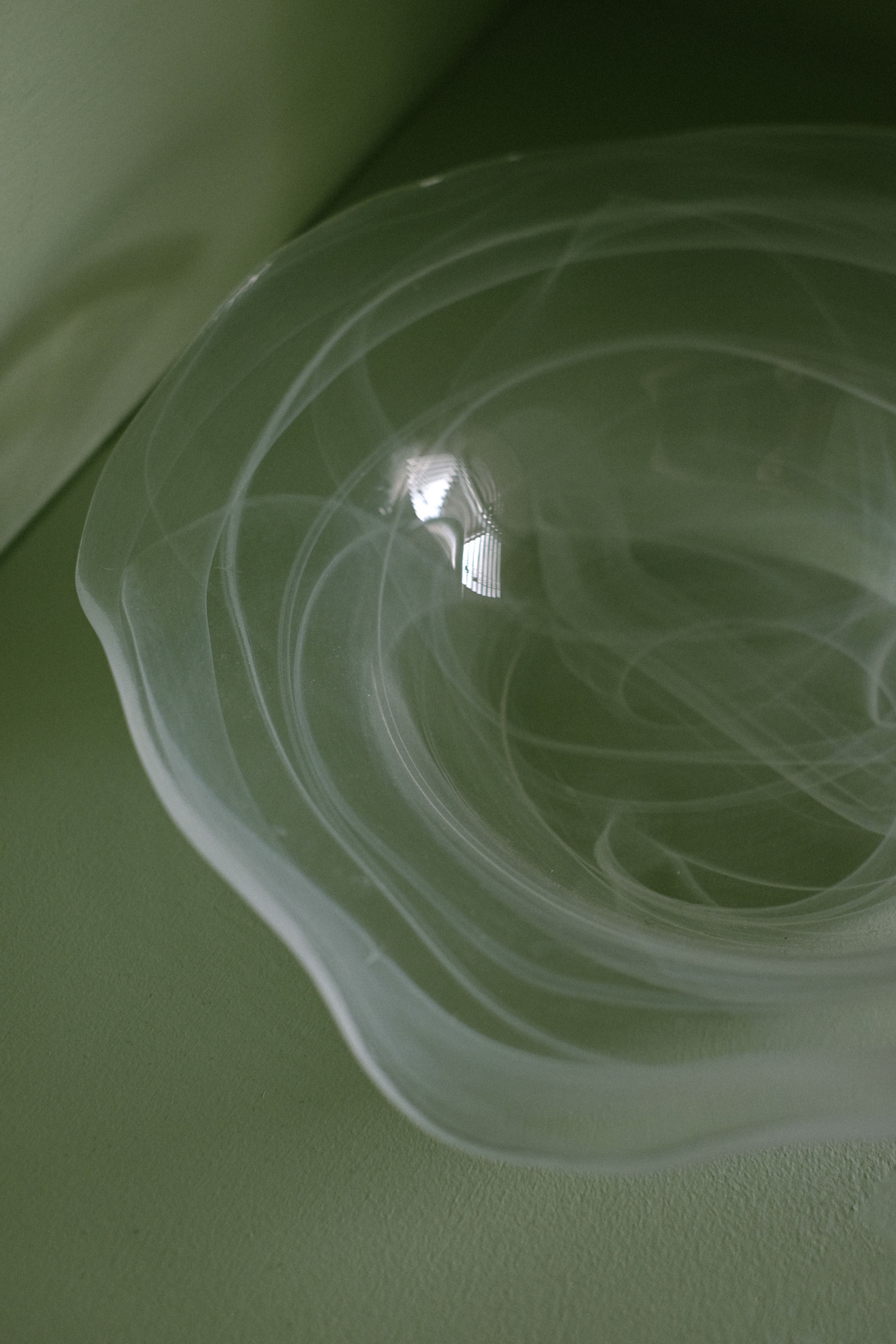 Swirl Glass Bowl — close-up of translucent glass with swirling patterns