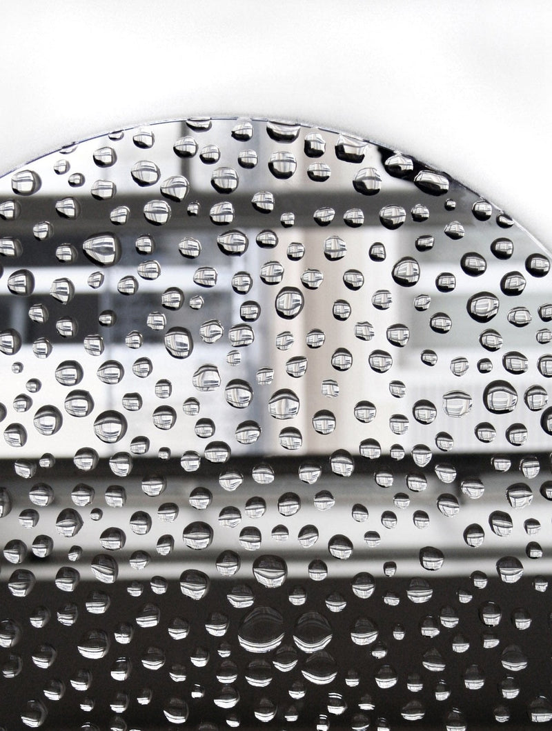 Mirror 11H20 — close-up of reflective surface with water droplets