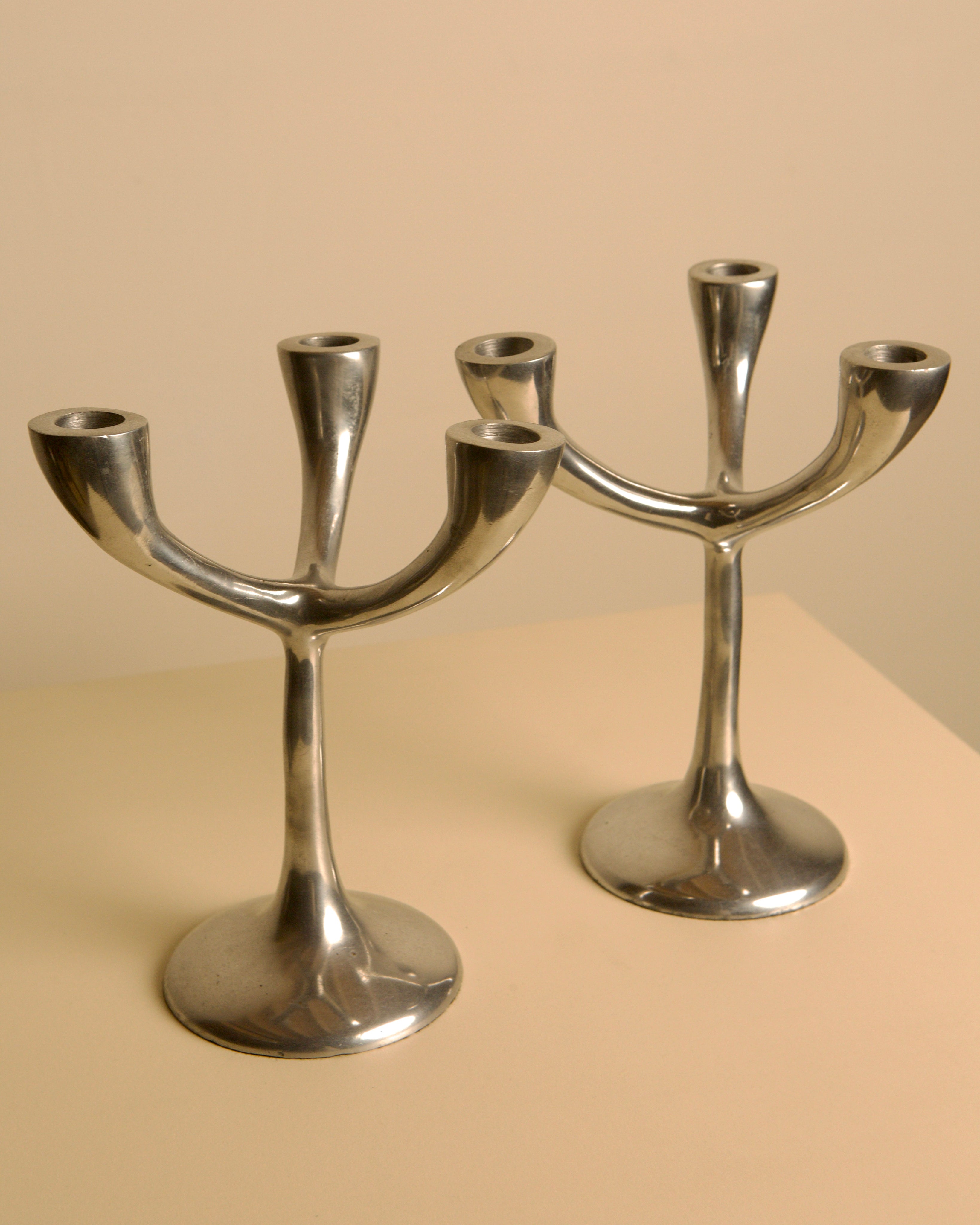 Pair of Italian "Tree" candlesticks from the 70s — side angle showing polished metal finish