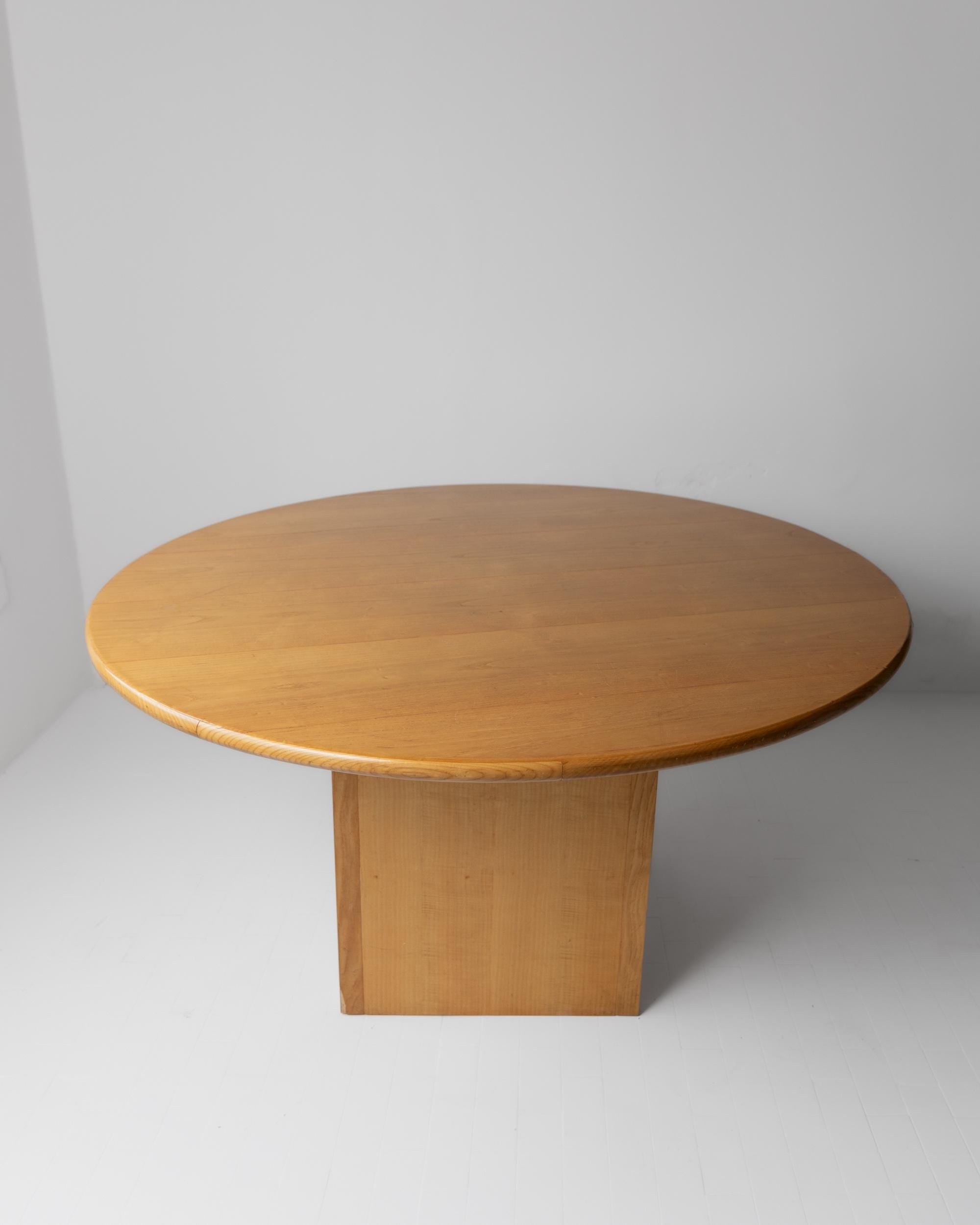 1980s Large Round Wooden Table — angled view on white floor