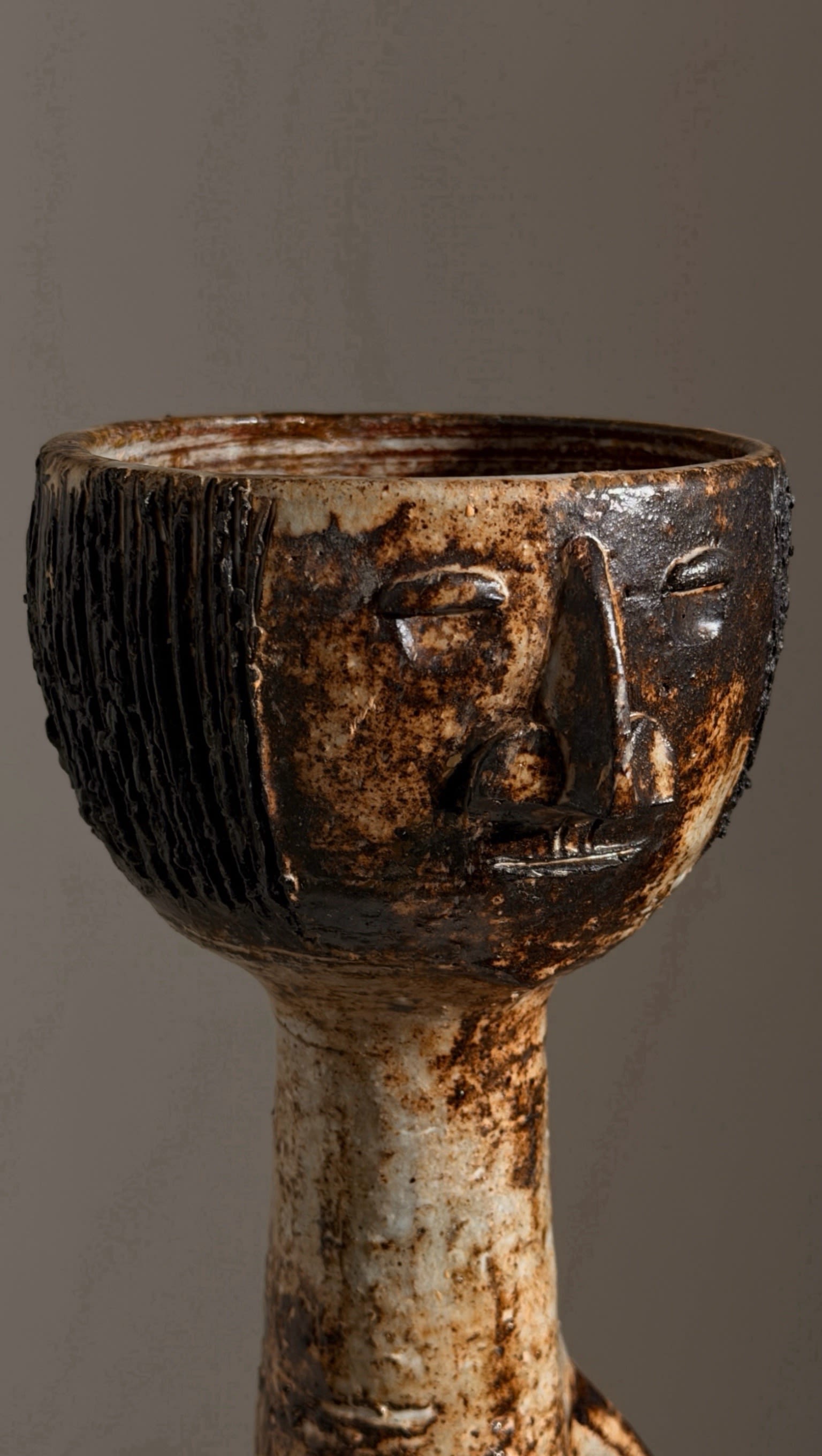 Monumental anthropomorphic pitcher by Jacques Pouchain — side angle showing textured ceramic surface