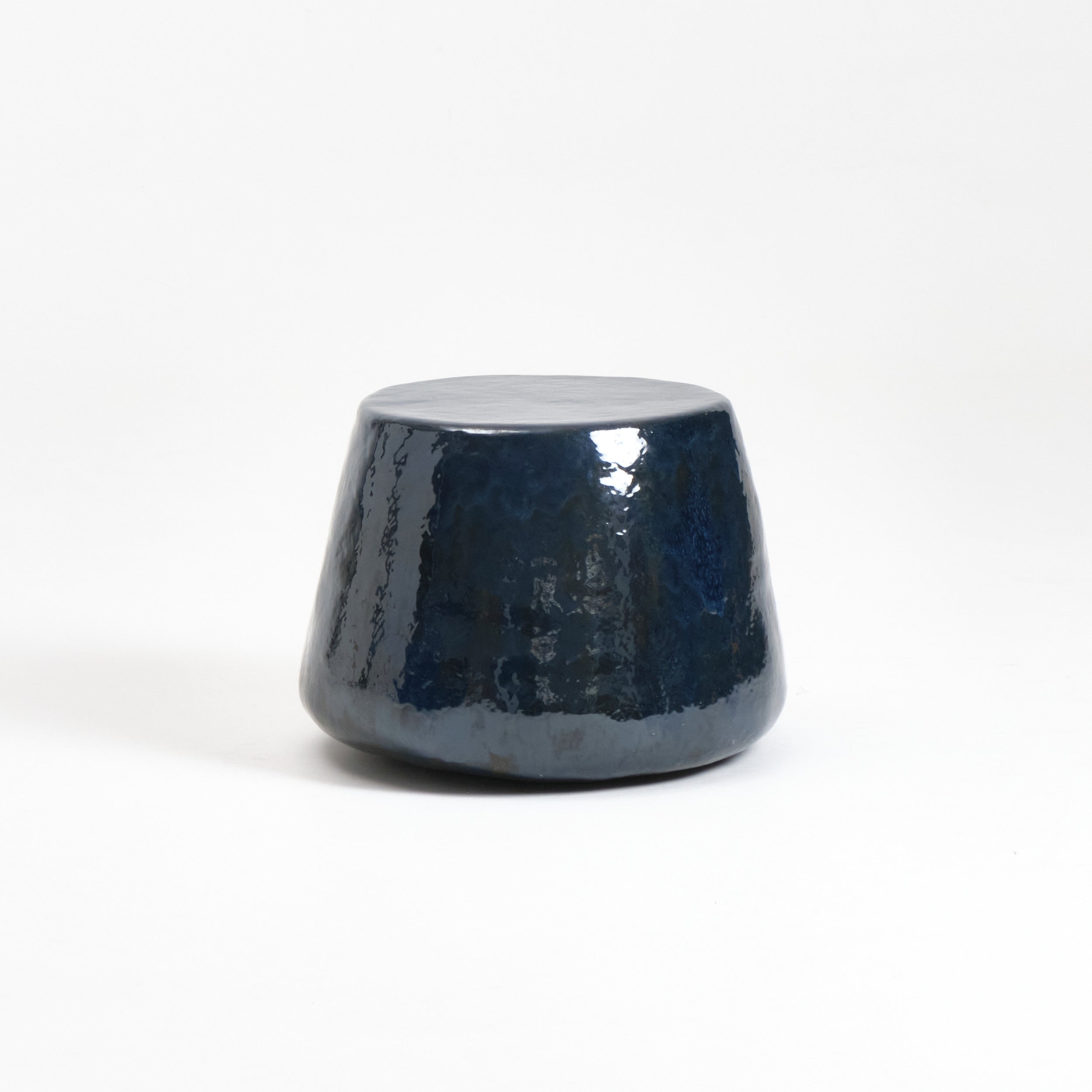 Medium Ceramic Side Table — top view of glossy navy surface