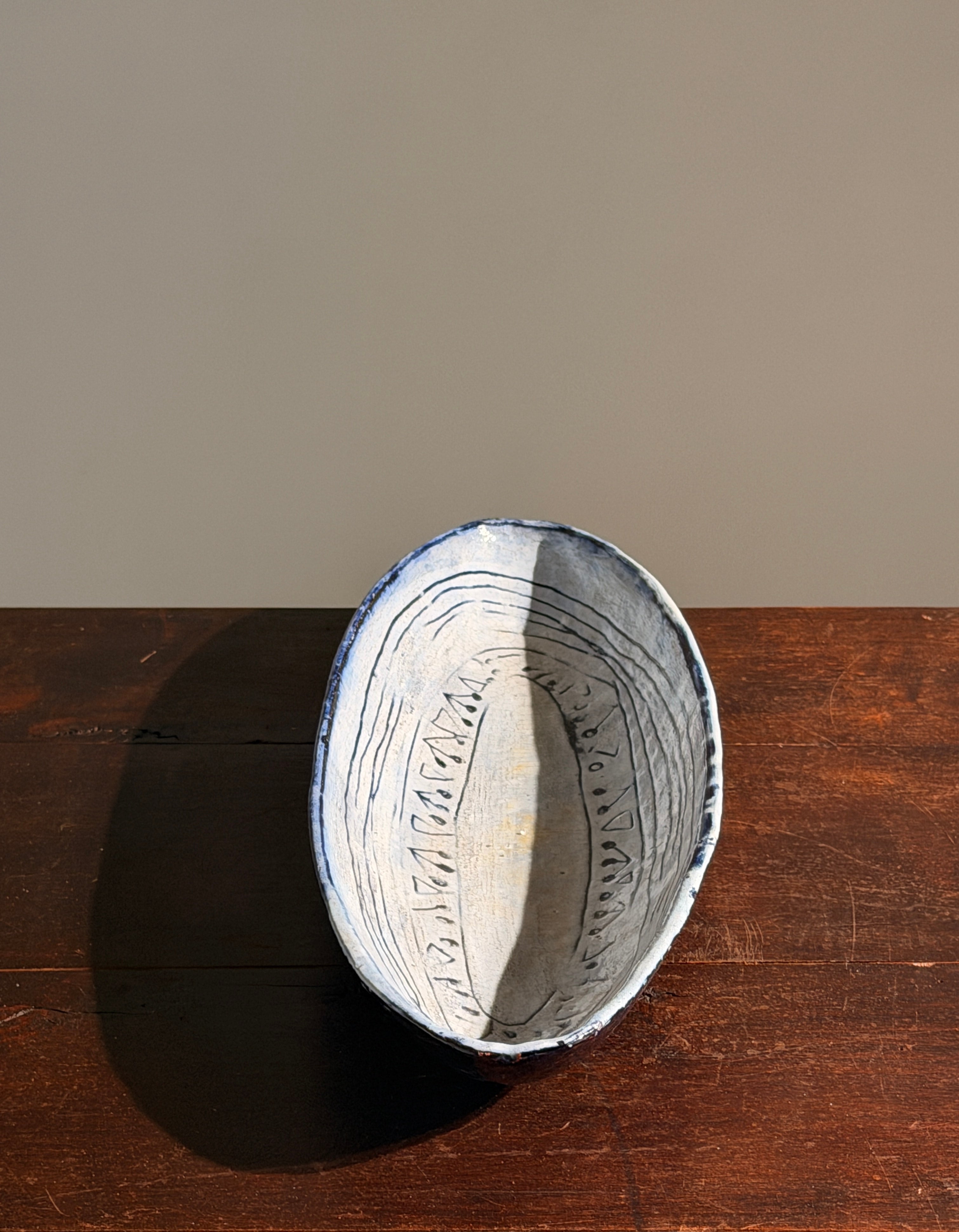 Large navette dish in glazed ceramic, signed Acly, France, 1964 — side angle