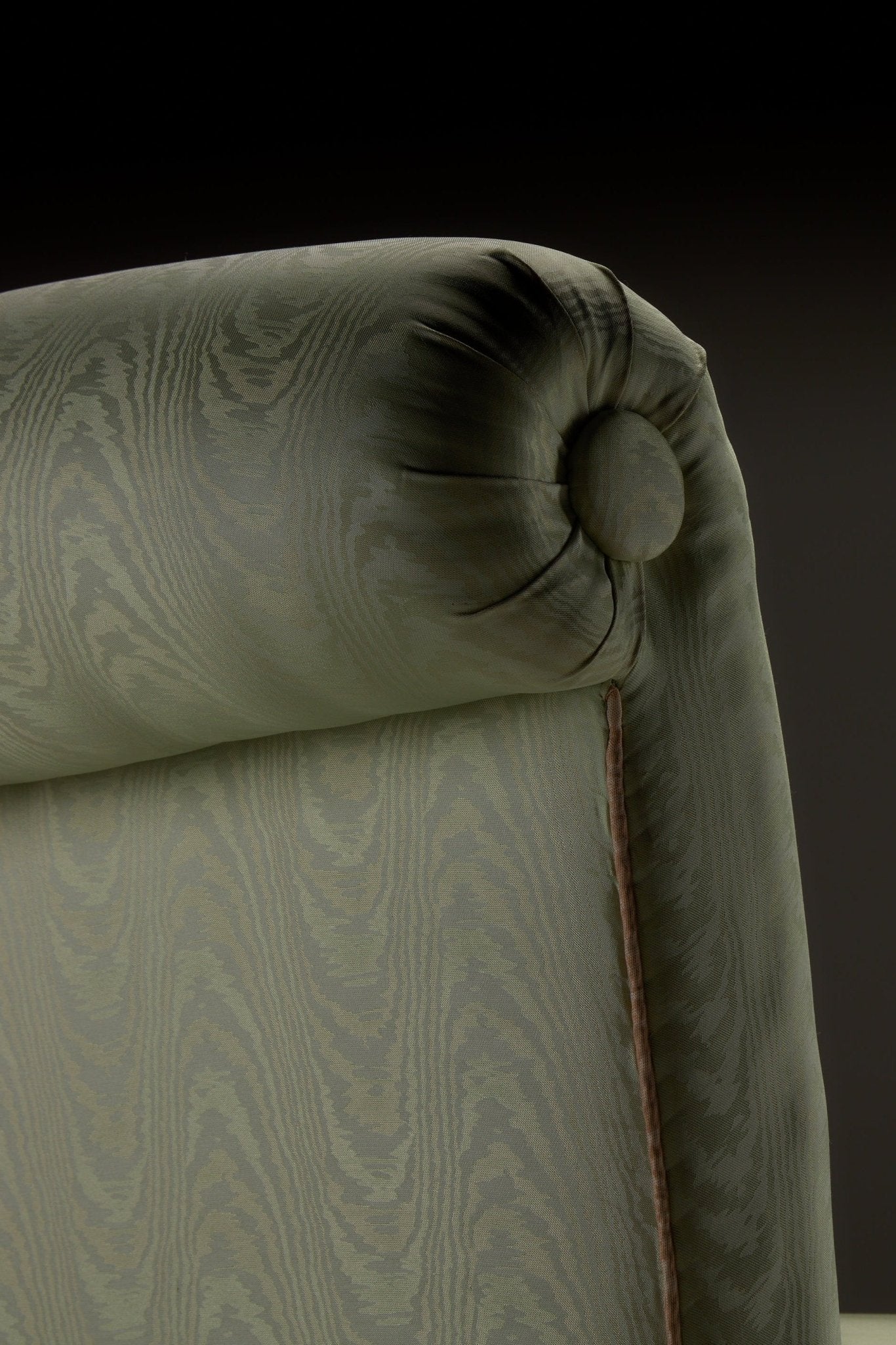 HESTIA SLIPPER CHAIR — close-up of green upholstered backrest