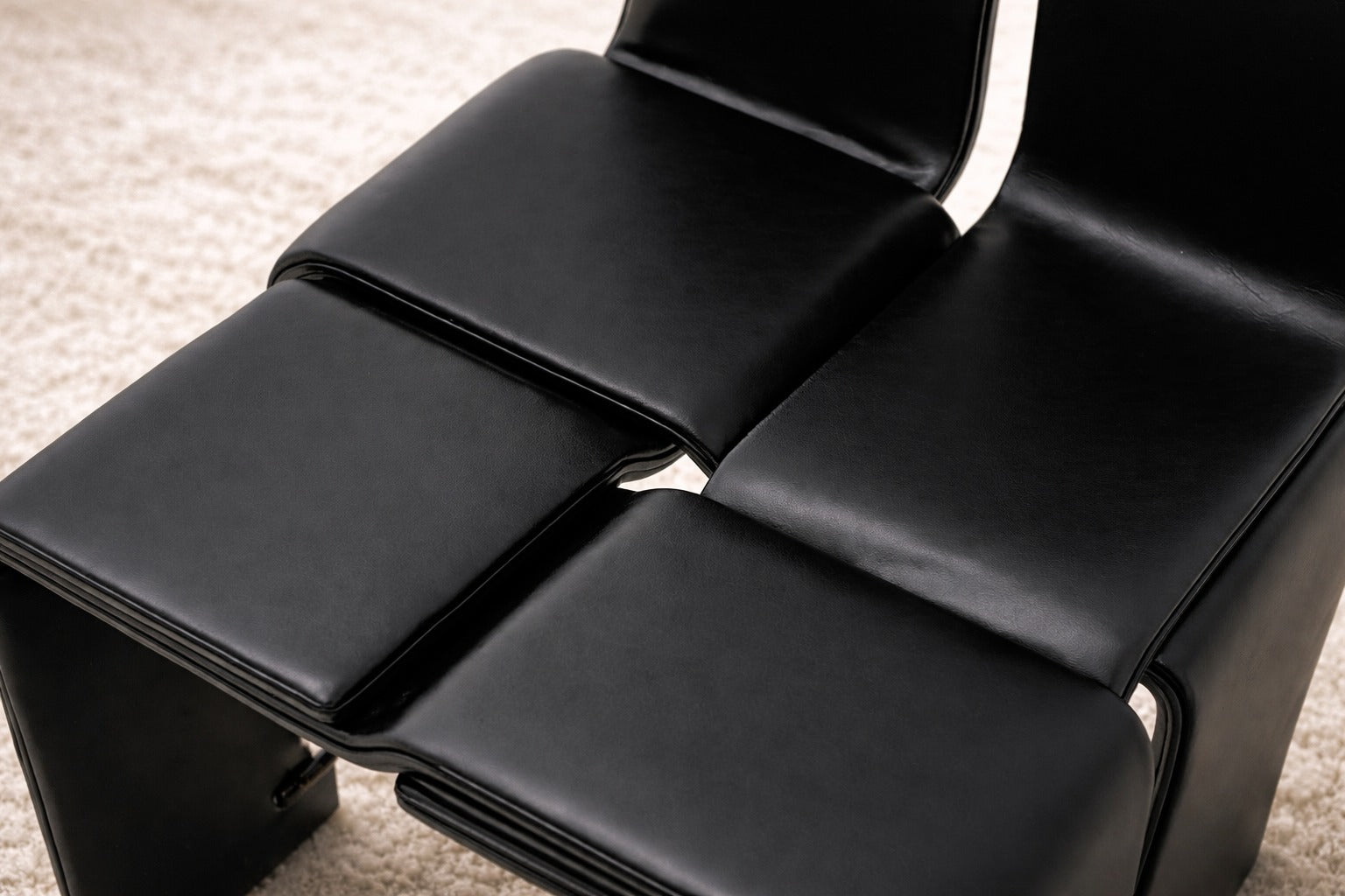 Weaving Chair - Leather — back view highlighting black leather upholstery