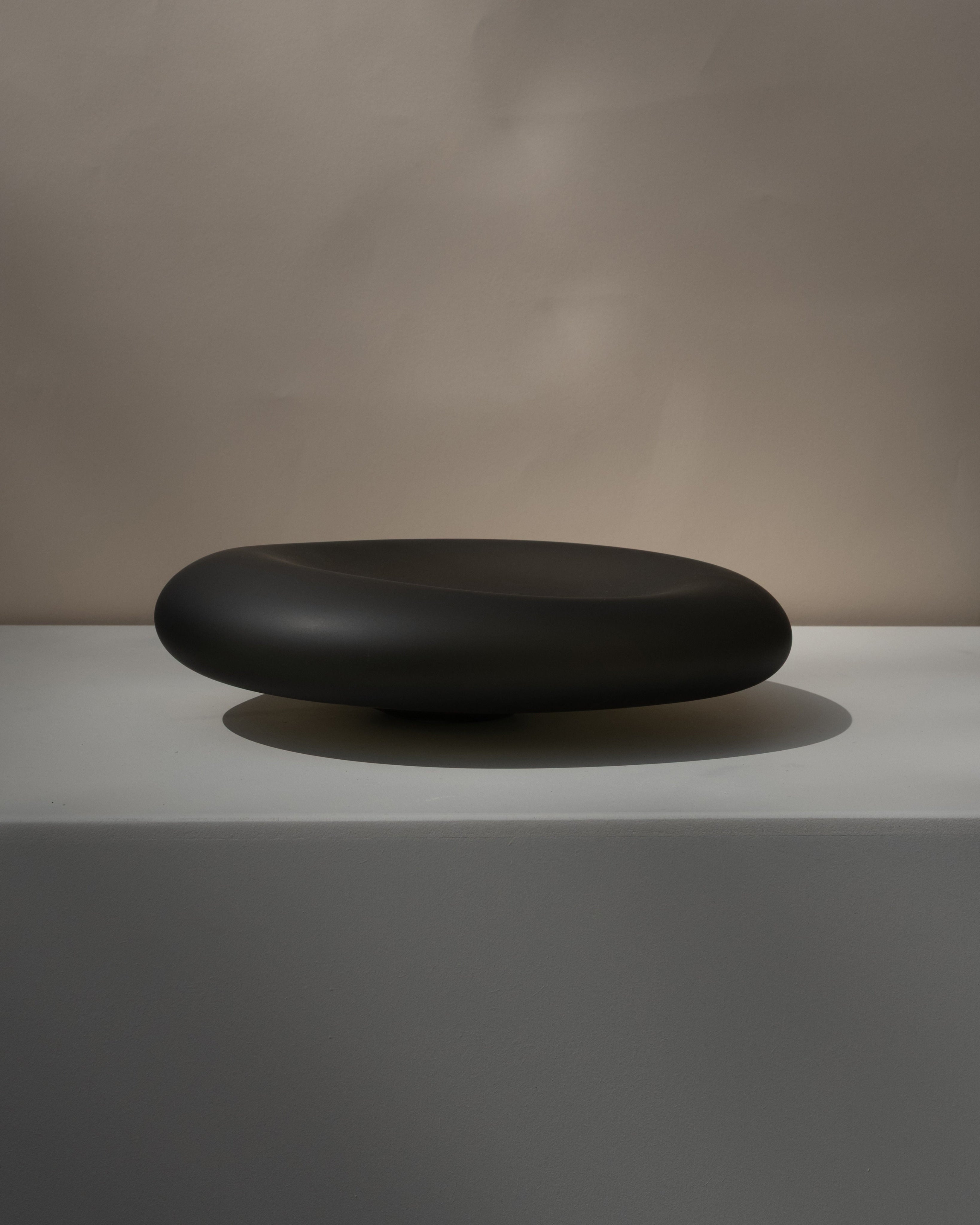 Glass Sculptures SEAGLASS | color midnight black — side angle on white pedestal