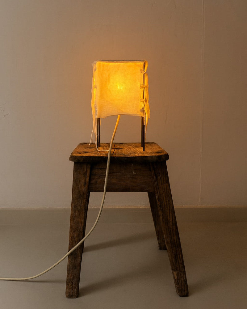 Bendito 01B golden fabric table lamp on wooden stool