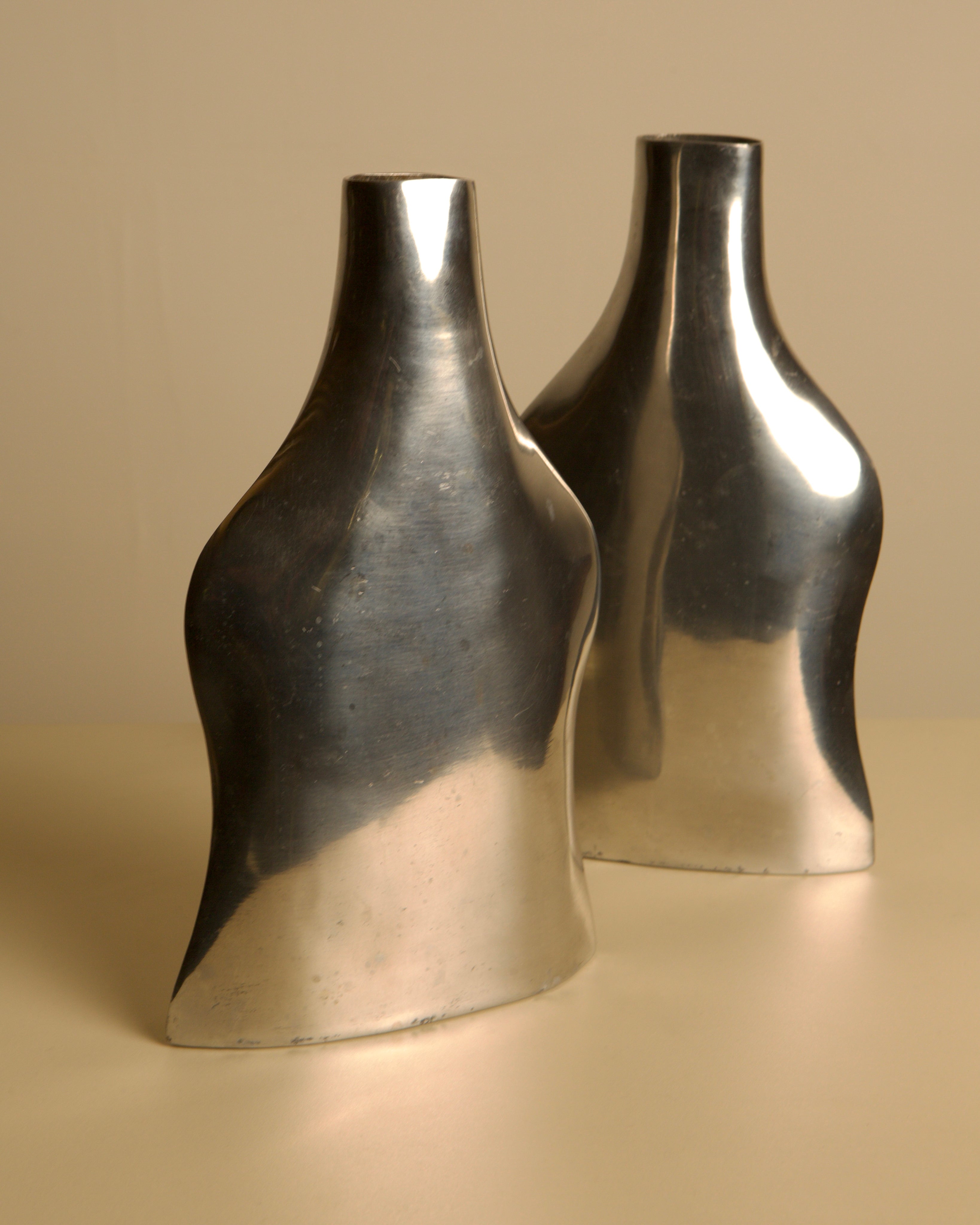 Pair of Italian Cast Aluminum Vases 1980s — side angle showing reflective surface