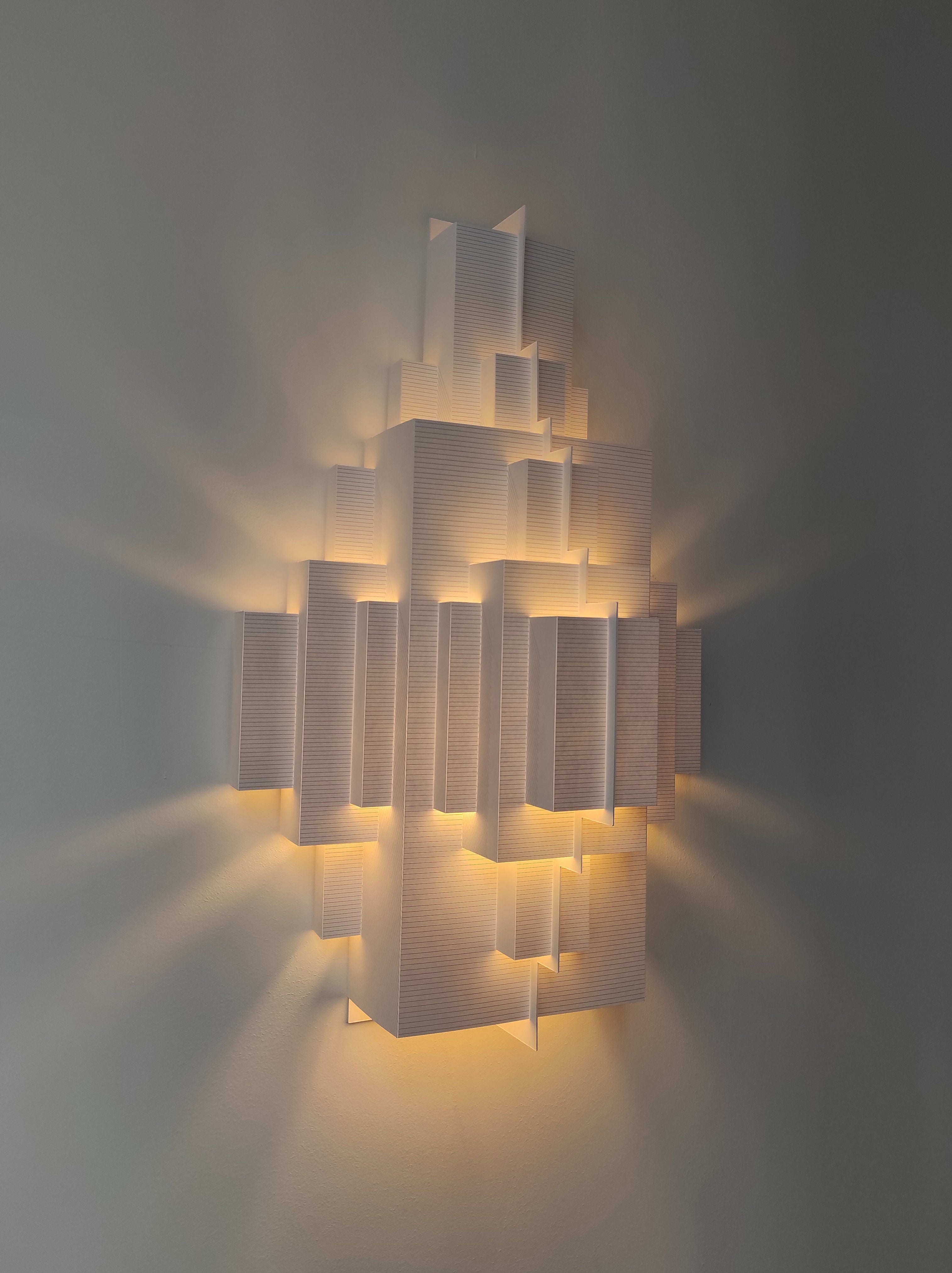 Cloud City Wall Lampshade — illuminated against a neutral wall
