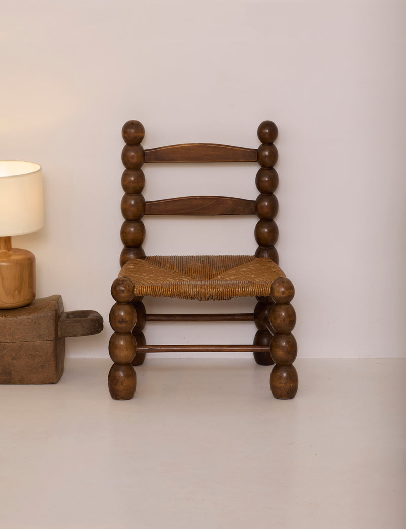 Vintage French Oak Wood and Straw Low Chair C. 1940 — front view highlighting round wooden legs