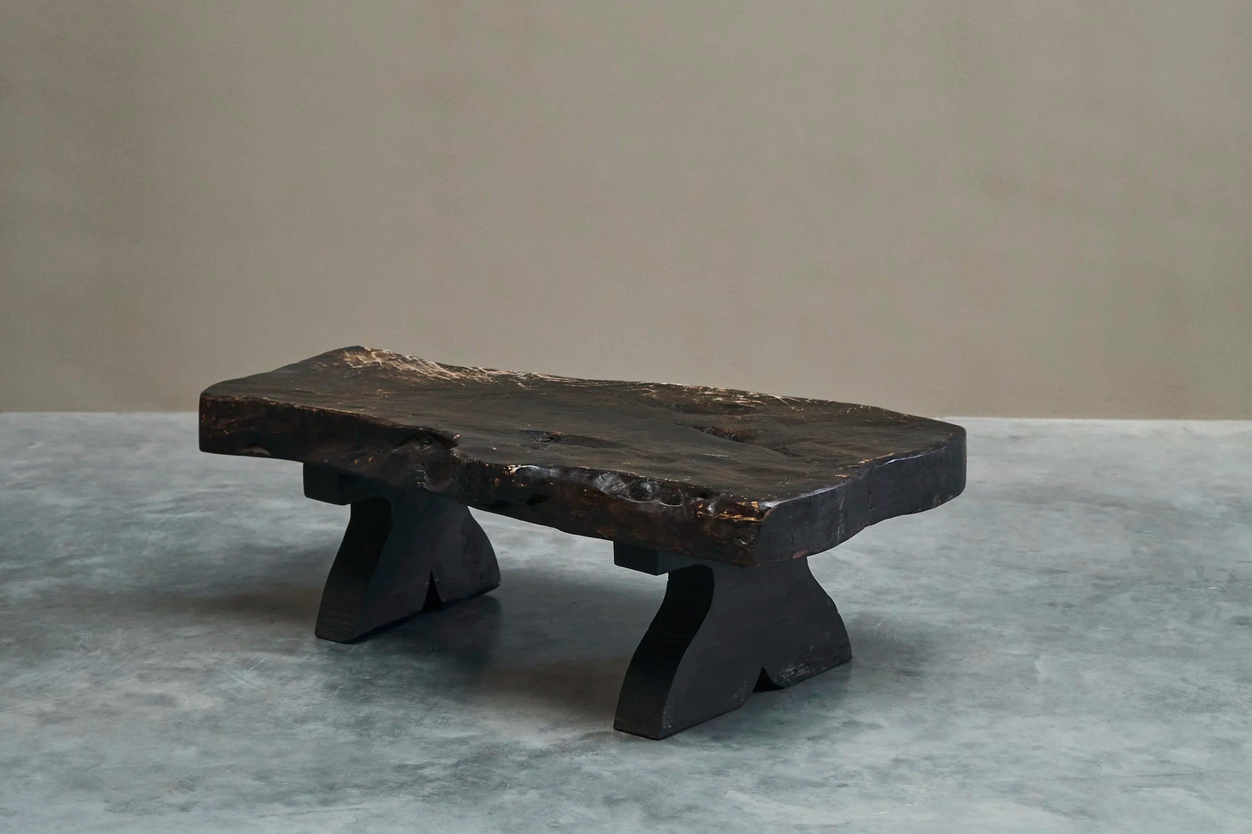 Sculptural Live Edge Coffee Table in Solid Dark Stained Wood — close-up