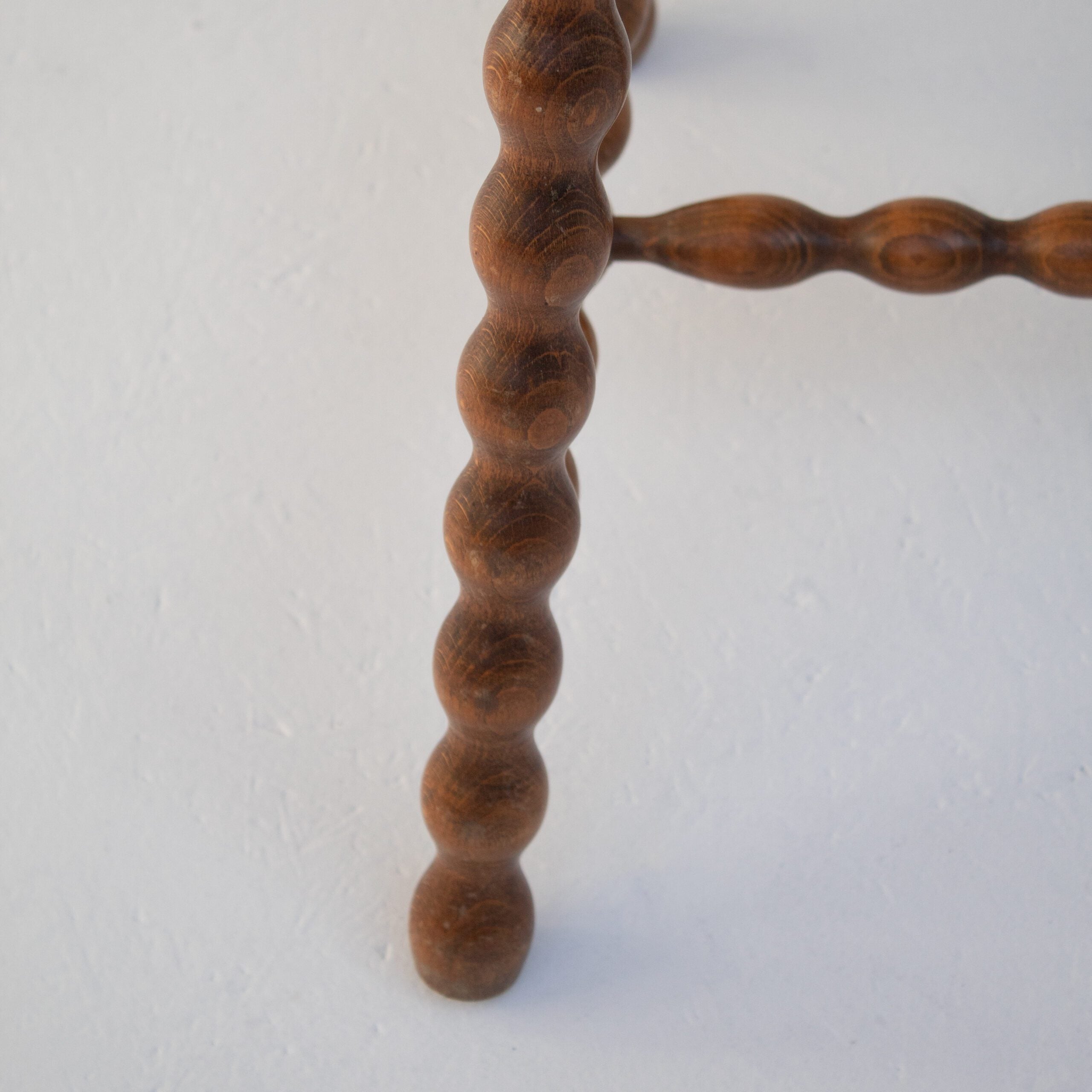 Pair of Vintage Wooden Bobbin Stools — top view of turned wooden legs