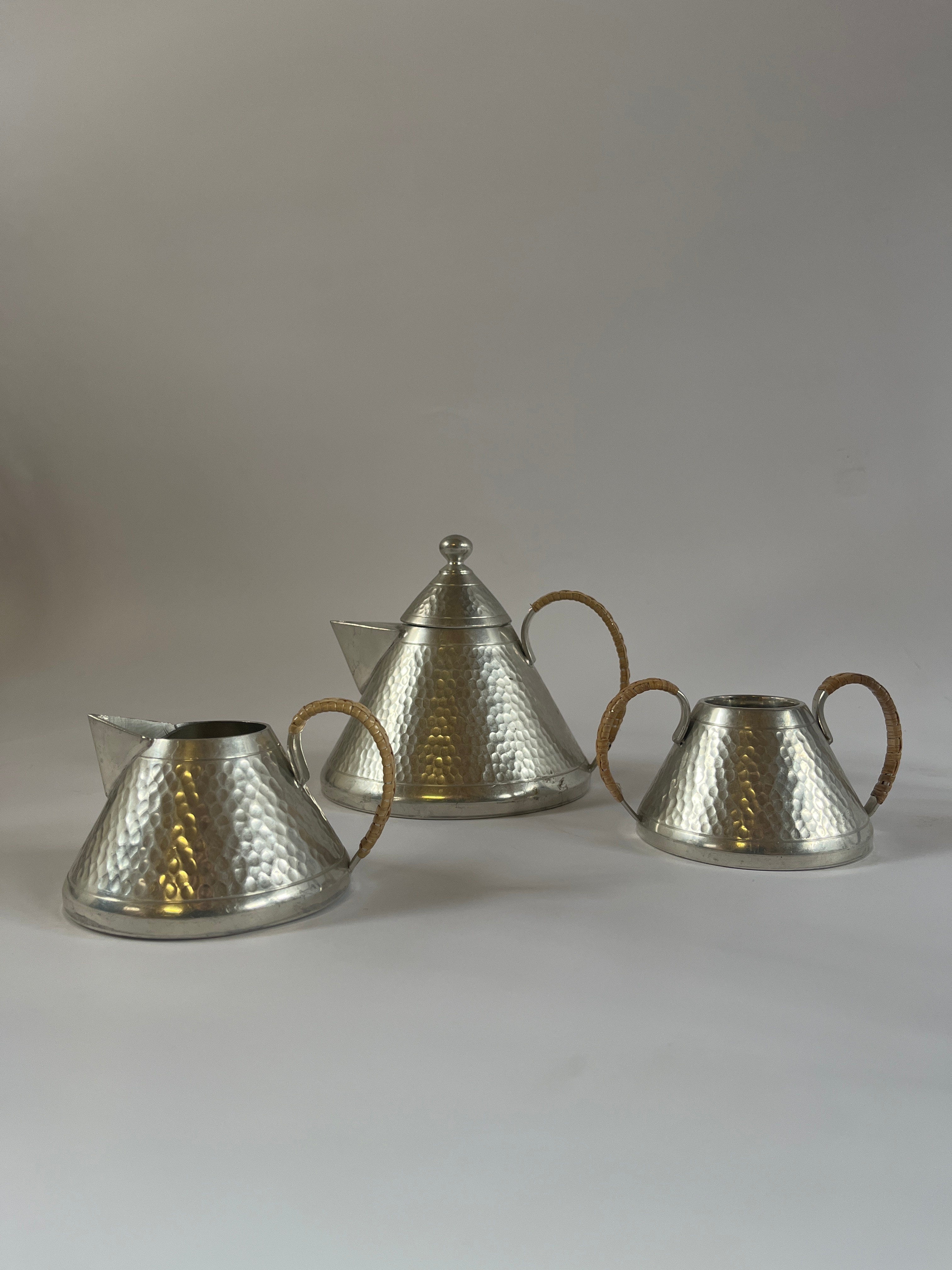 Art Deco Hammered Pewter Tea Set — top view of three pieces with textured surface