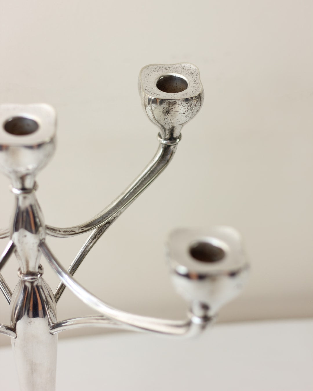 Vintage Alpaca Candleholder — angled view highlighting polished silver finish