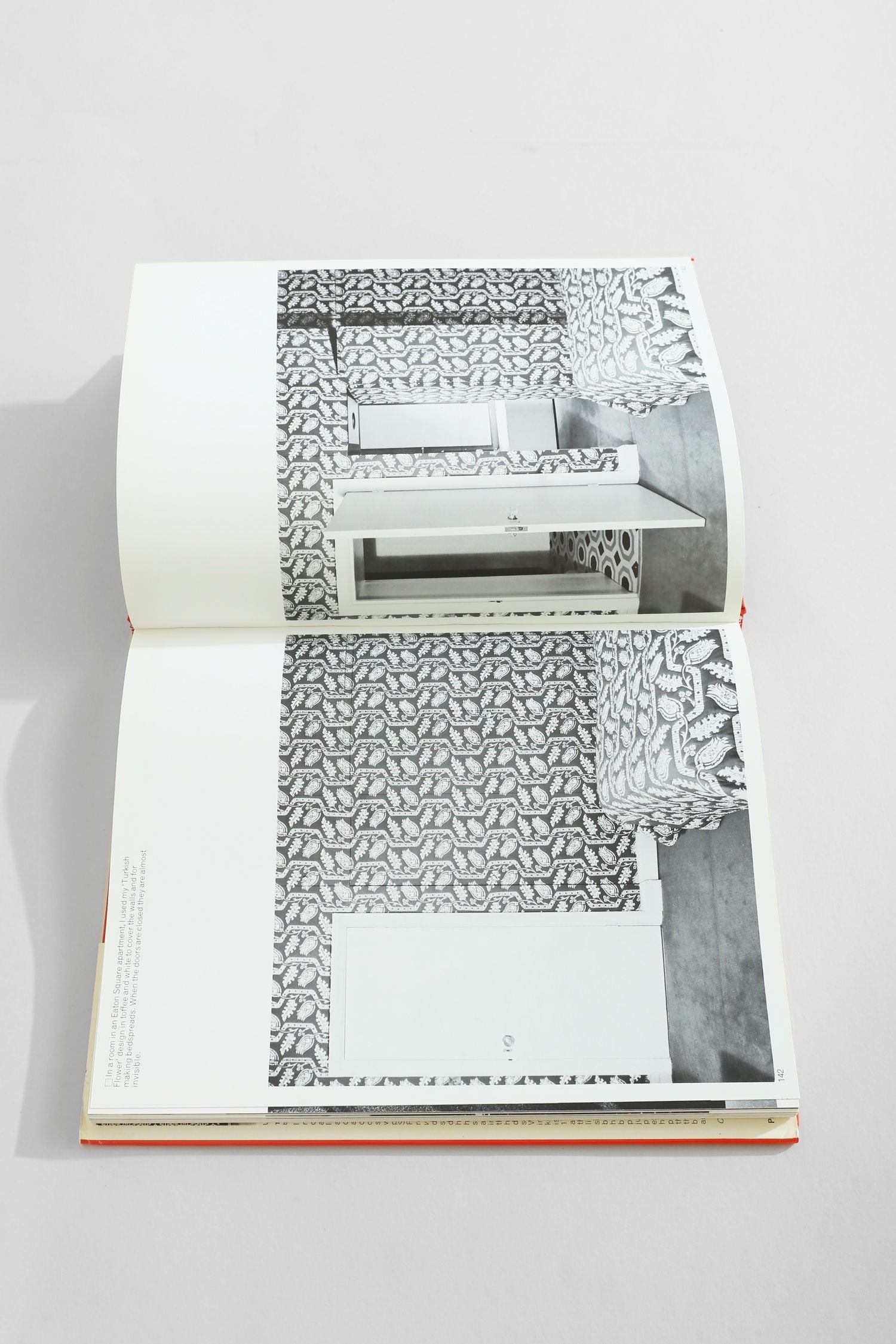 David Hicks on Home Decoration' Book — open on patterned page in modern setting