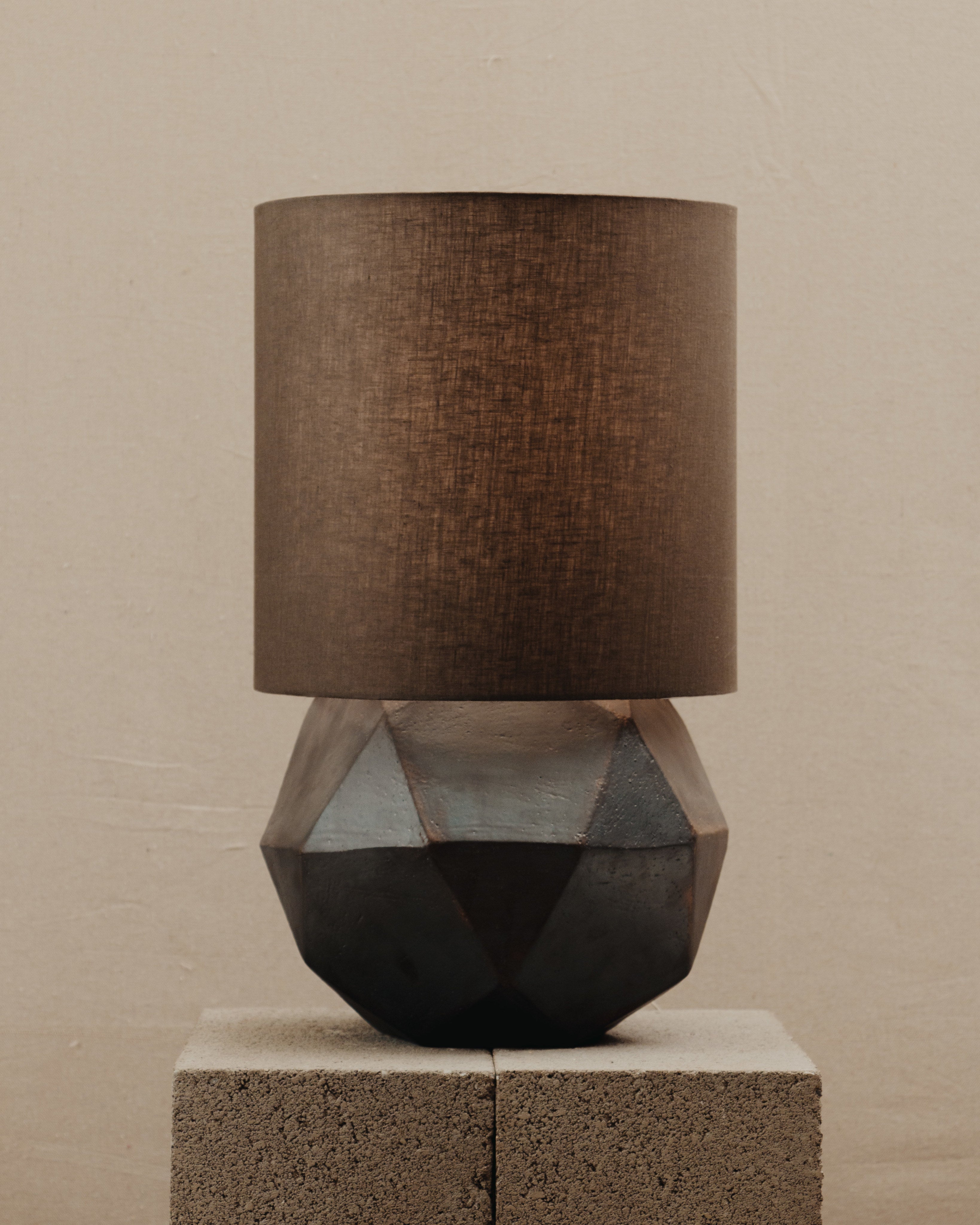 Geode Lamp — top view of geometric base with brown shade