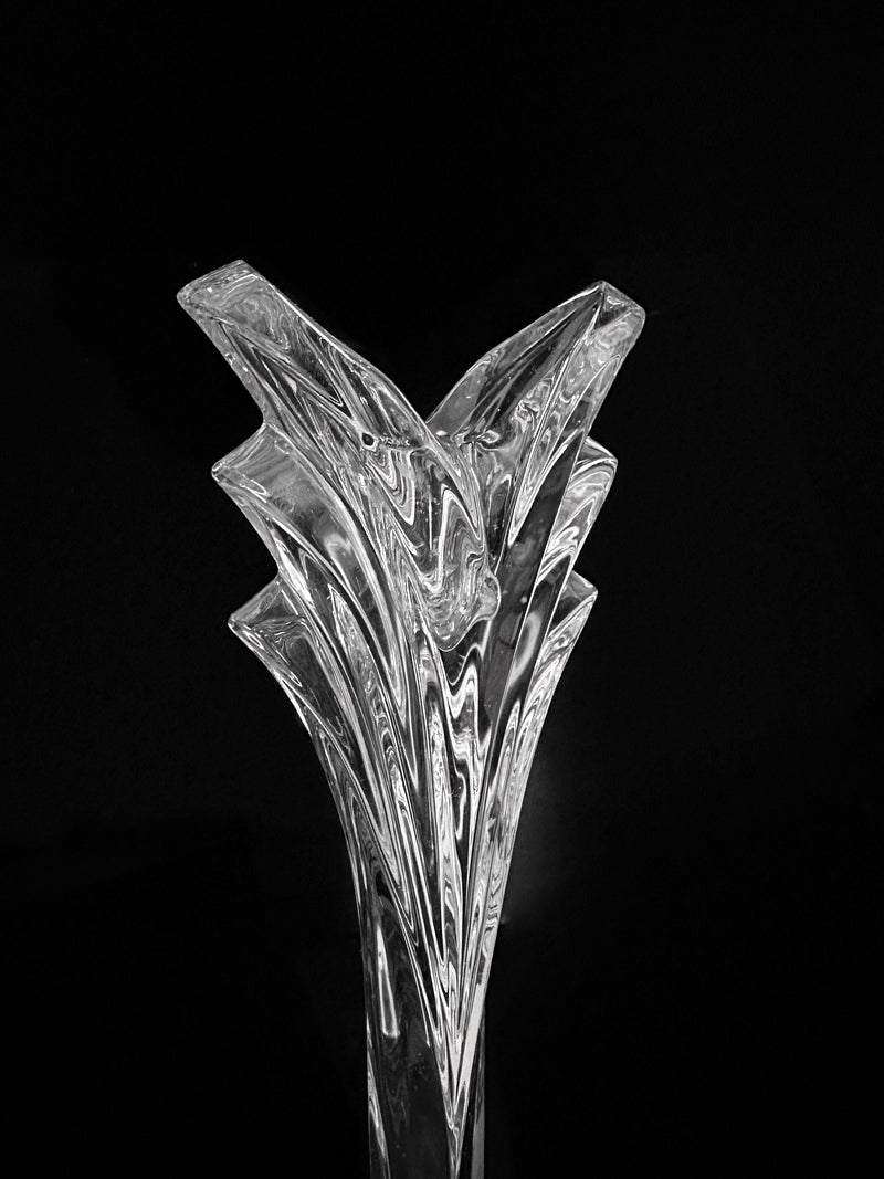 The Dodo Vintage Crystal Glass Candleholder - Nachtmann 1980s features clear, layered glass peaks in an Art Deco Revival style, set against a solid black background for a striking, sculptural look.
