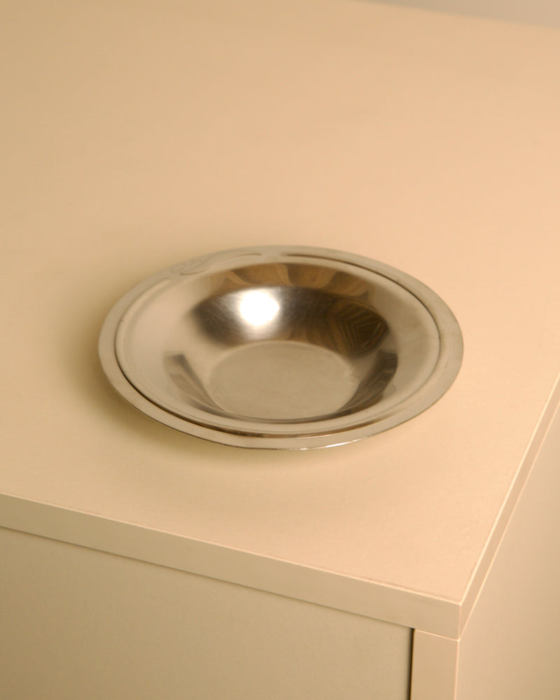 Circular stainless steel valet tray by Pierre Cardin, 1980s | The Oblist — vintage modern design