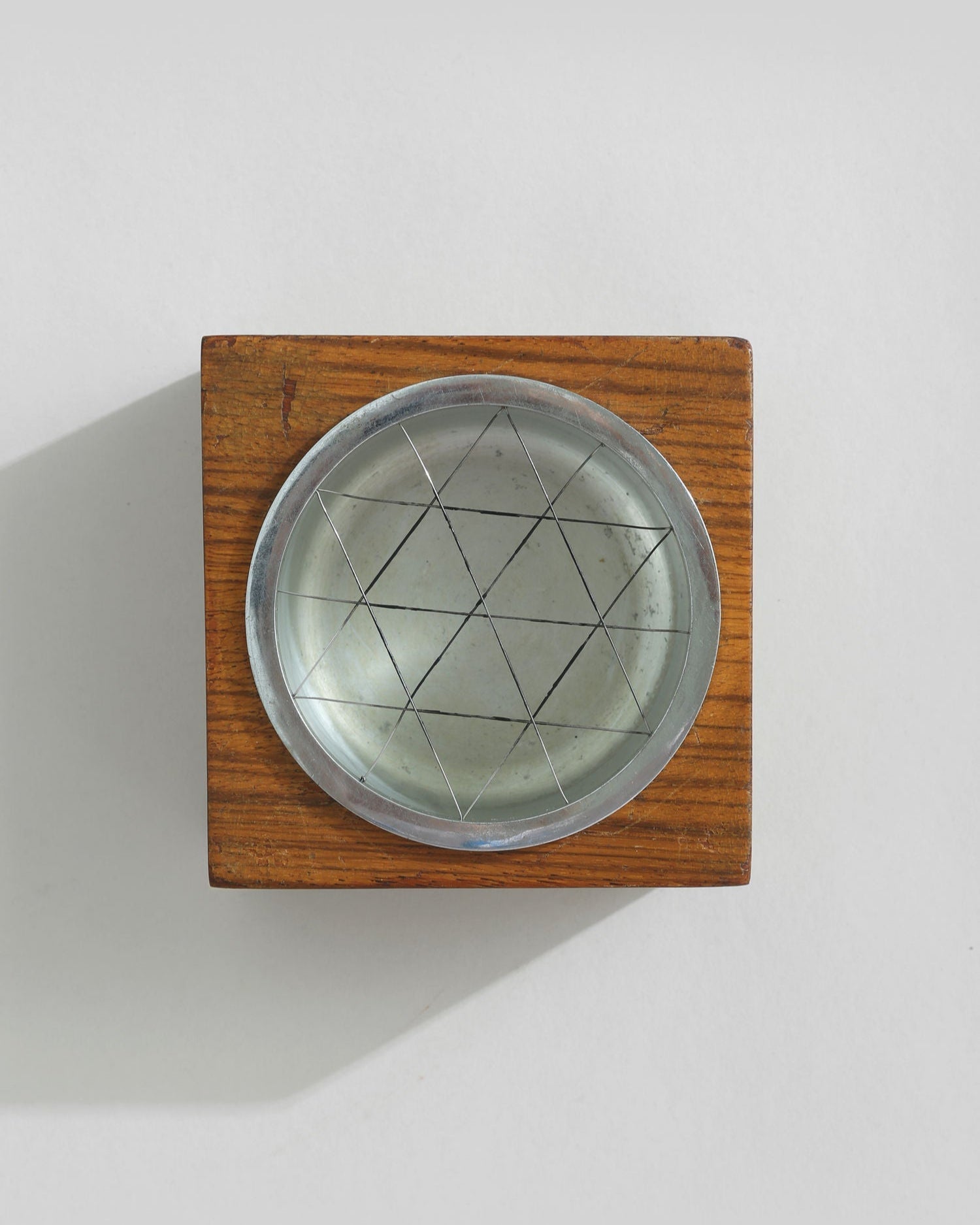 Mid-century wooden ashtray with geometric metal insert detail