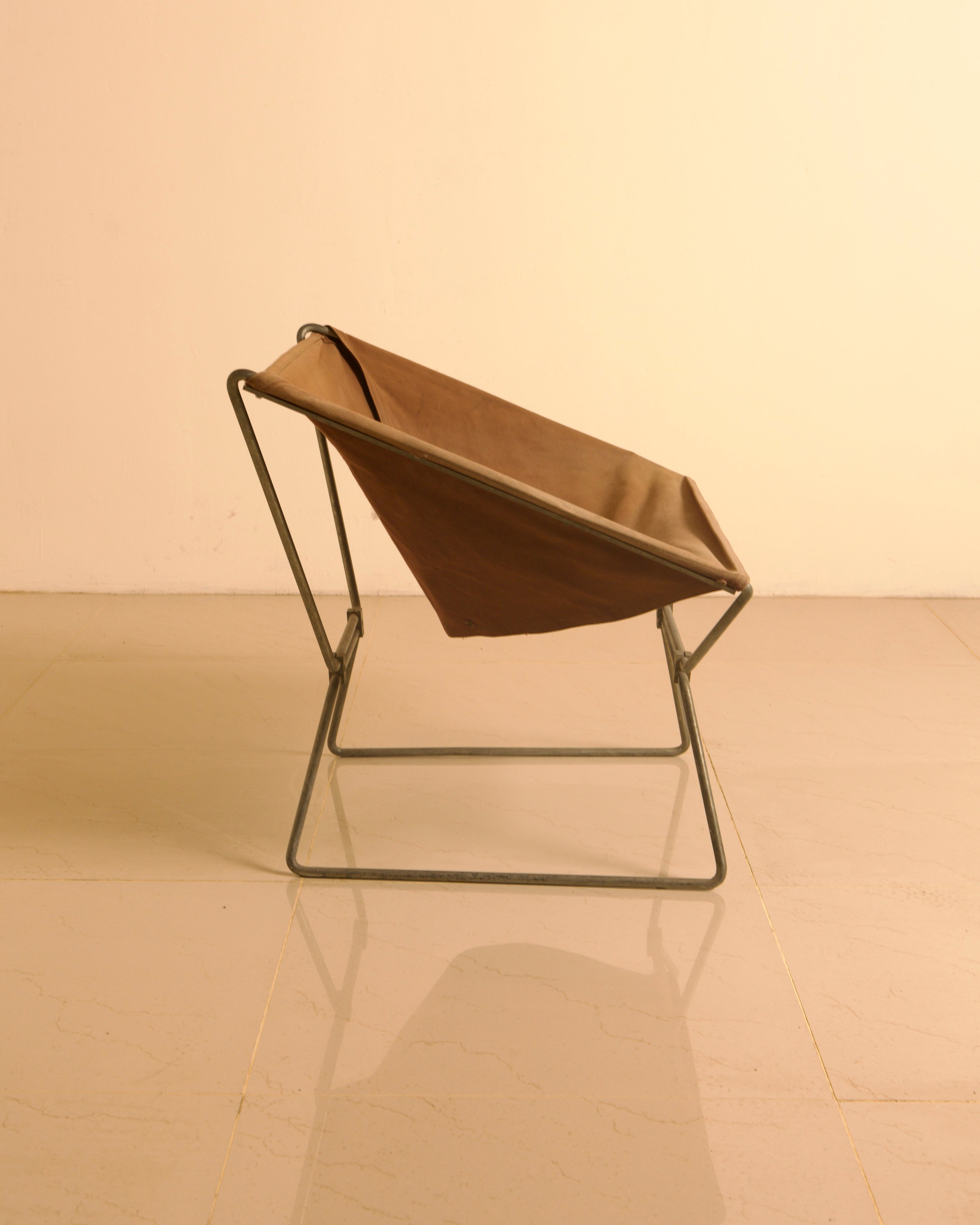AP-14 Armchair in Canvas by Pierre Paulin for AP Polak, 1950s — side view highlighting brown canvas and metal frame