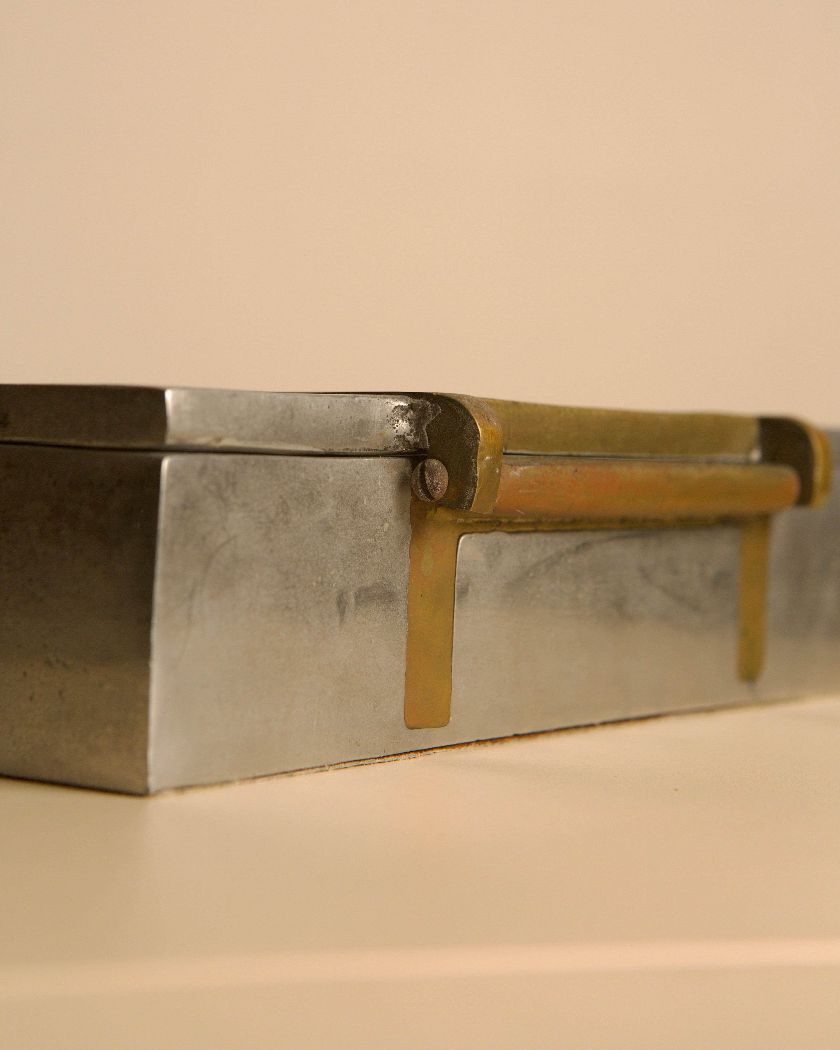 Large brutalist metal and brass box by David Marshall 70s — close-up