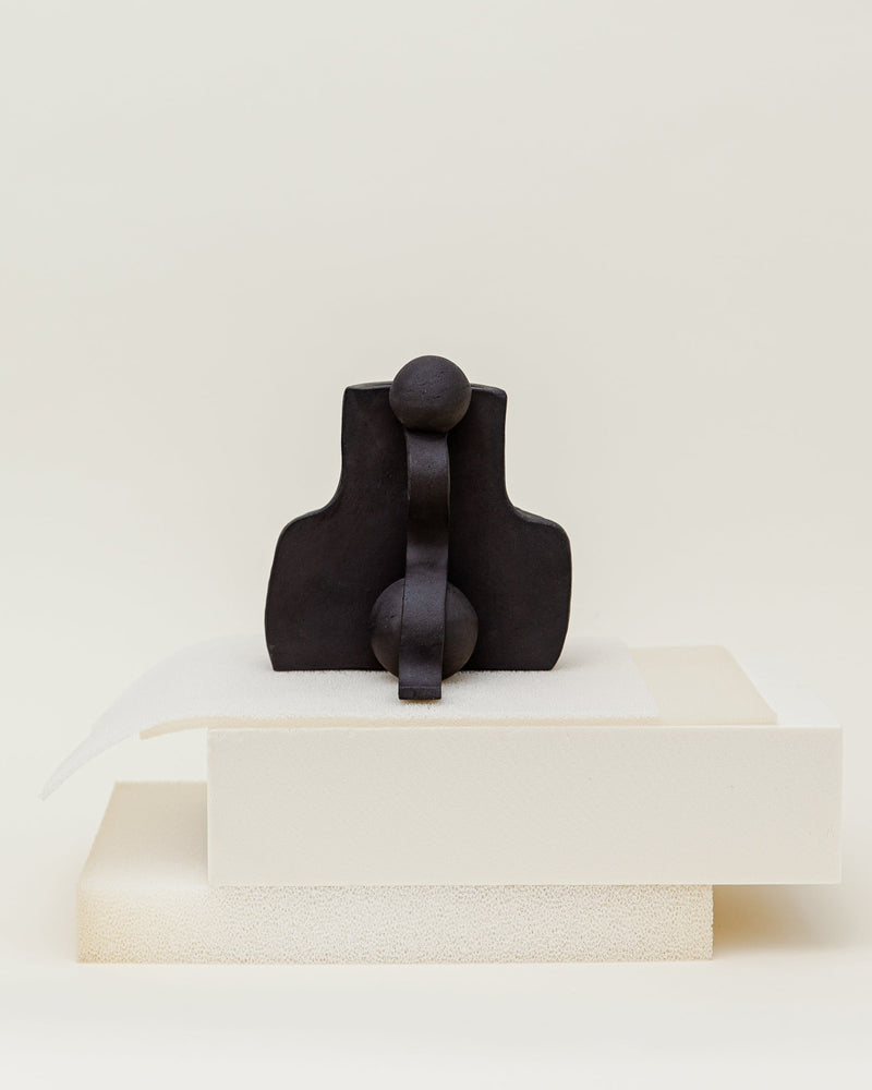 Dark ceramic Fragment vase by Ia Kutateladze on white pedestal