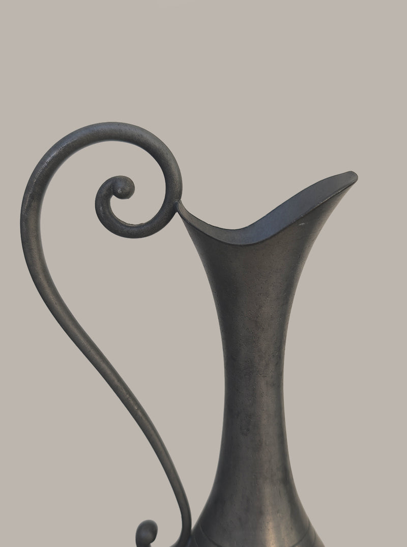 Pewter Vase — close-up of curved handle and spout