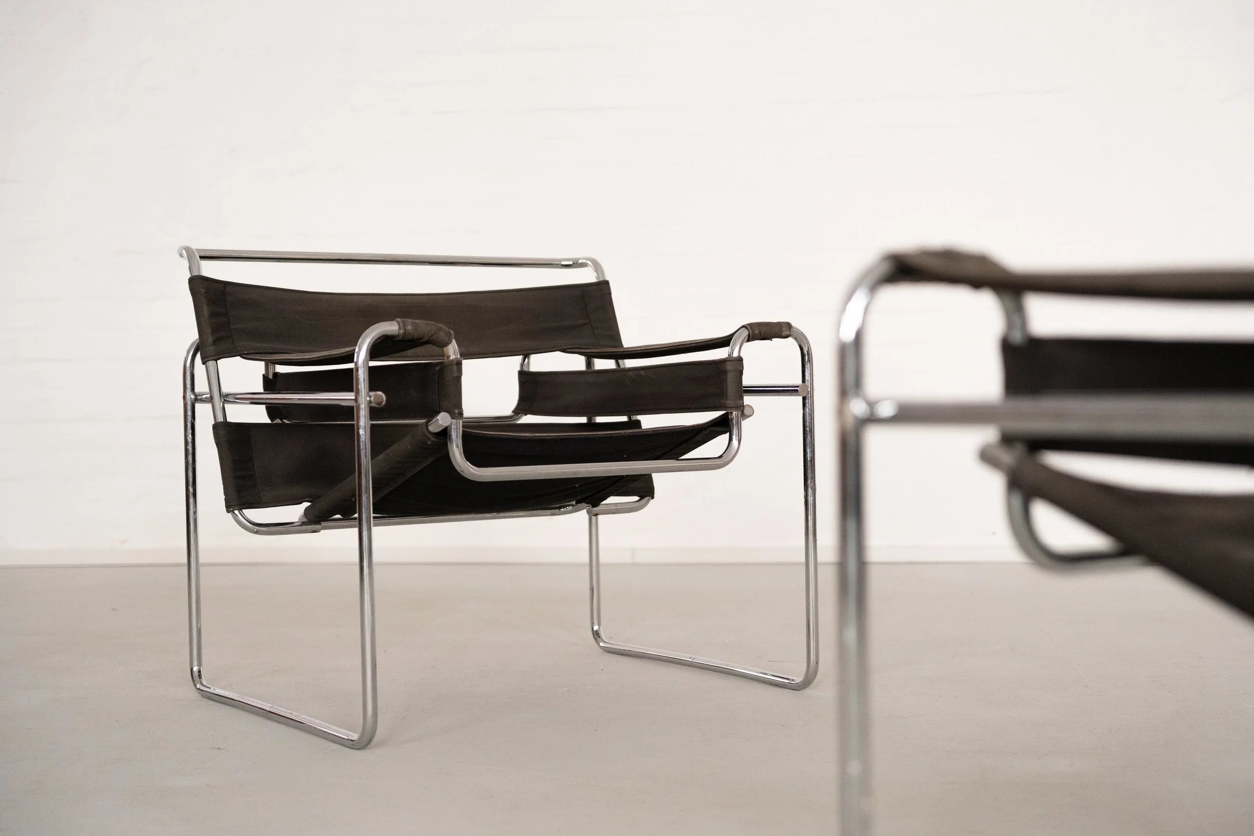 Wassily Chair by Marcel Breuer for Gavina — angled view showing black canvas and chrome frame