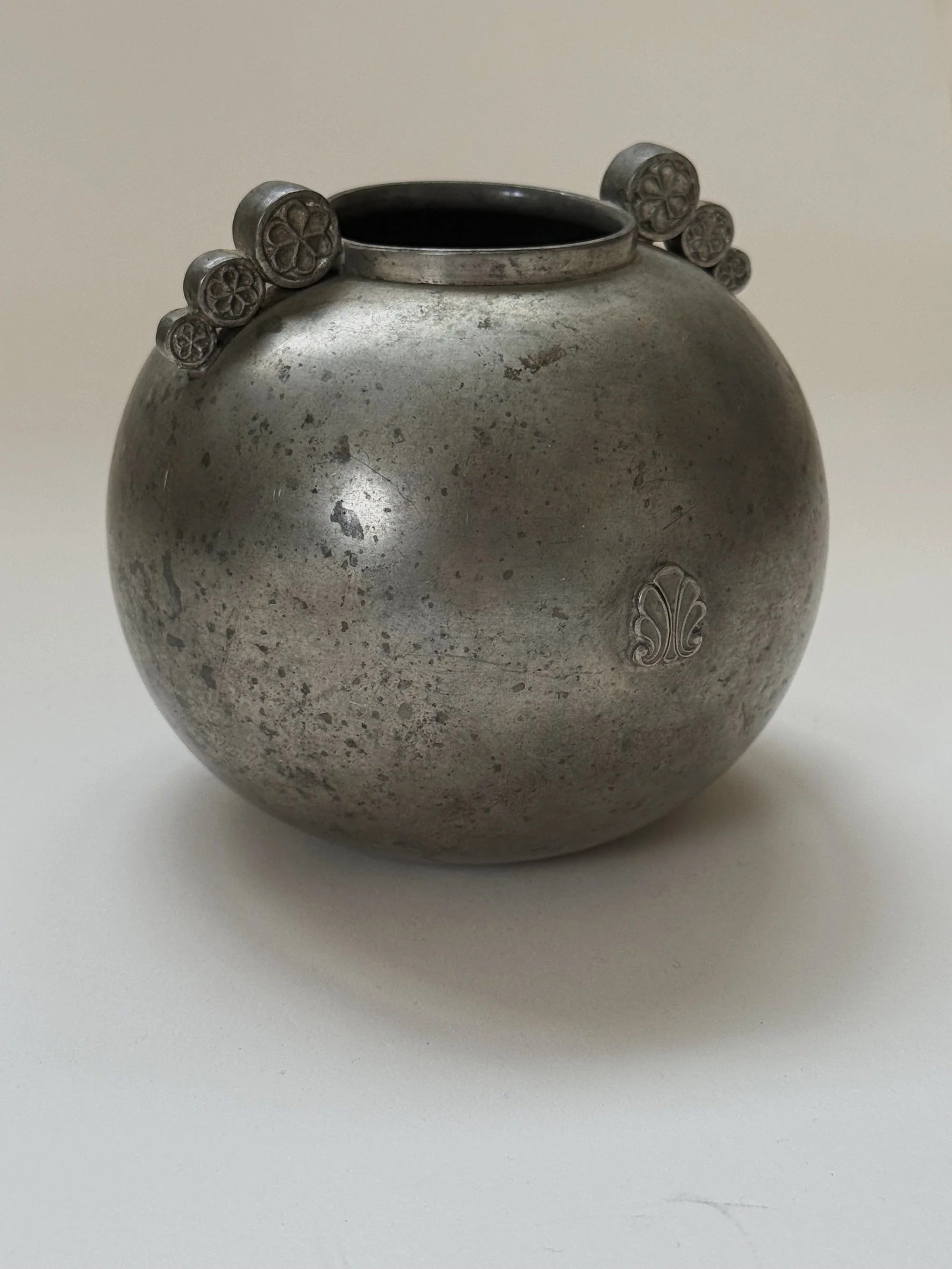 Swedish Grace Spherical Pewter Vase, 1934 — angled view highlighting textured pewter surface